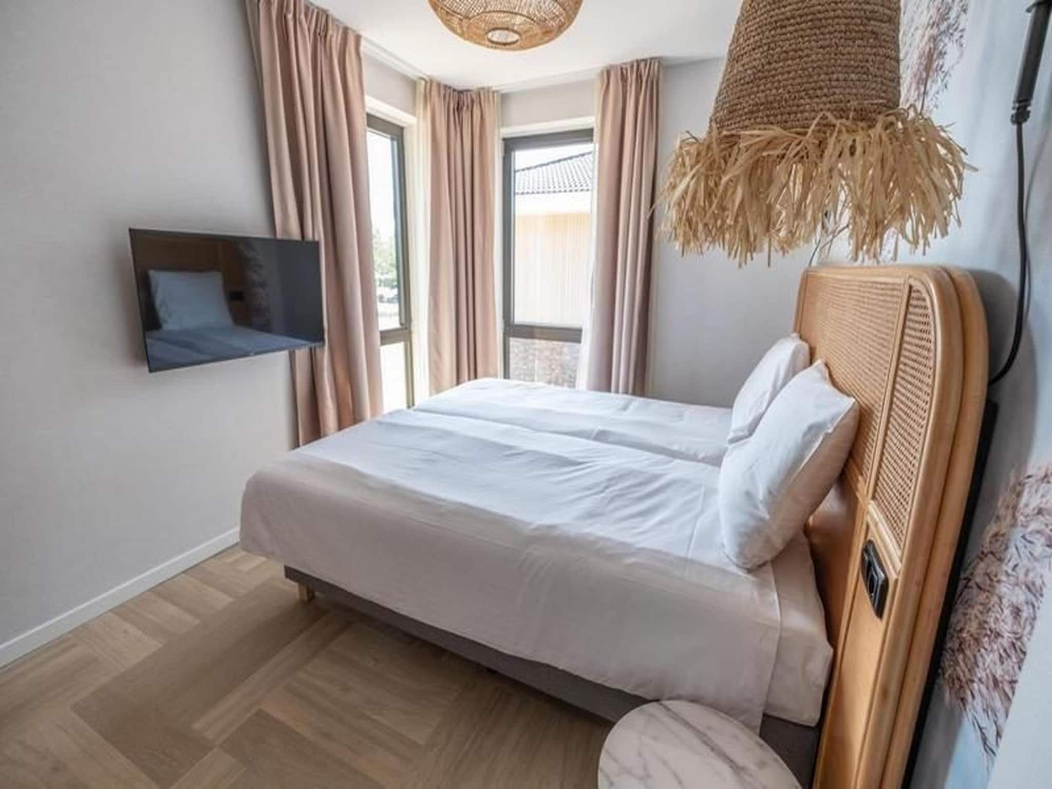Een slaapkamer van Luxury Beach Apartment | 4+2 Pers. in Workum