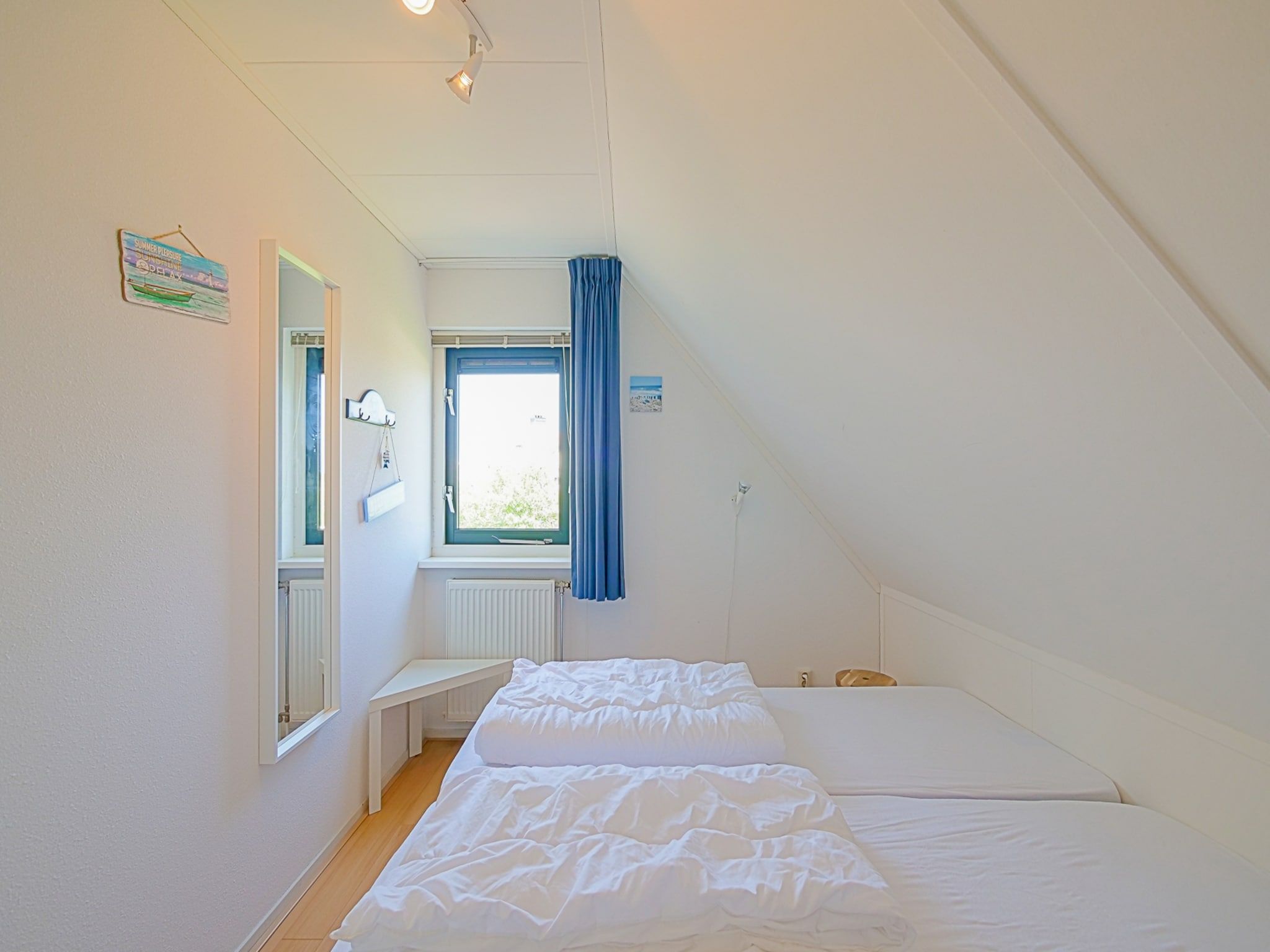 Een slaapkamer van Villa Noorderzon in Julianadorp