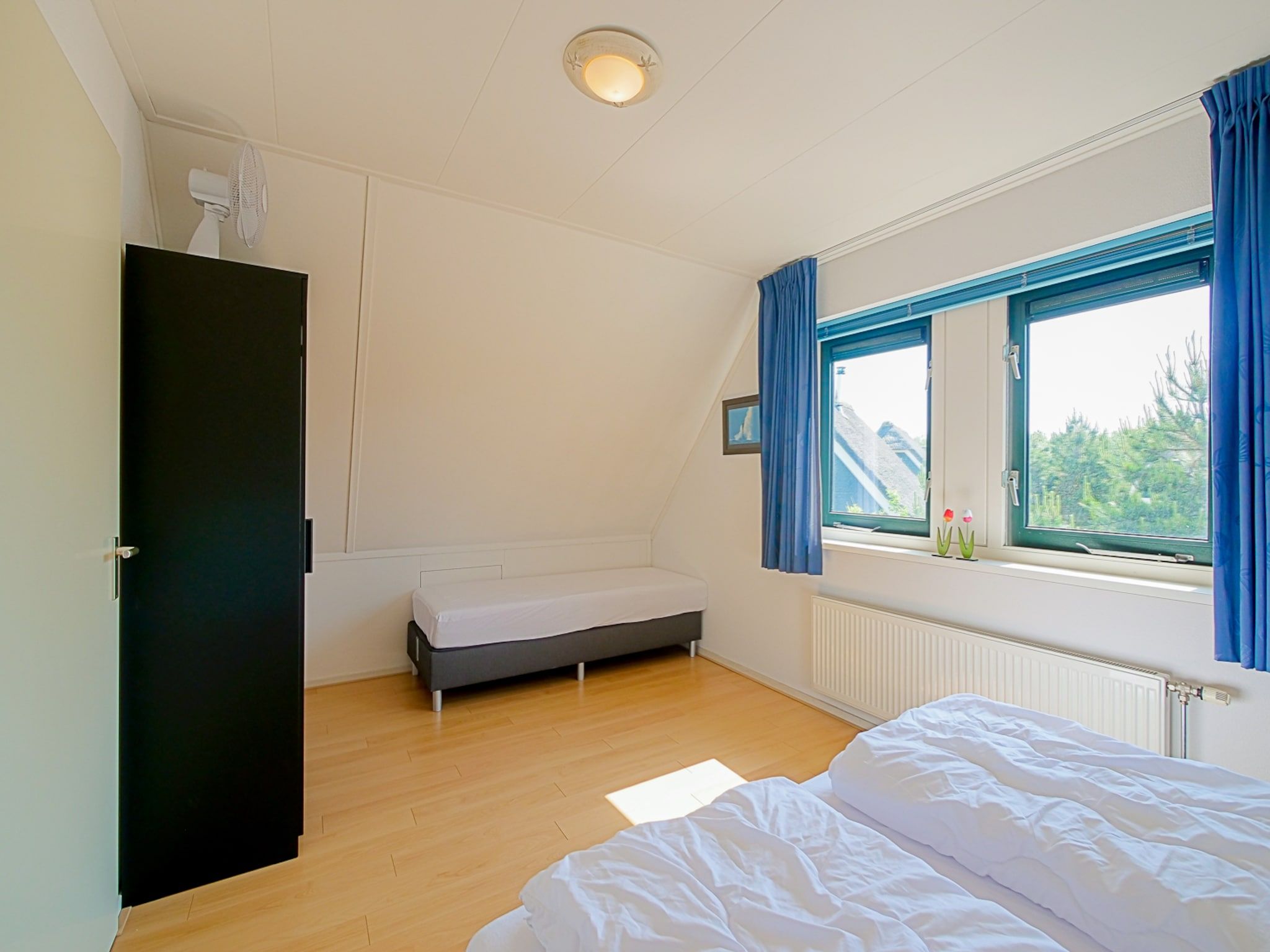 Een slaapkamer van Villa Noorderzon in Julianadorp