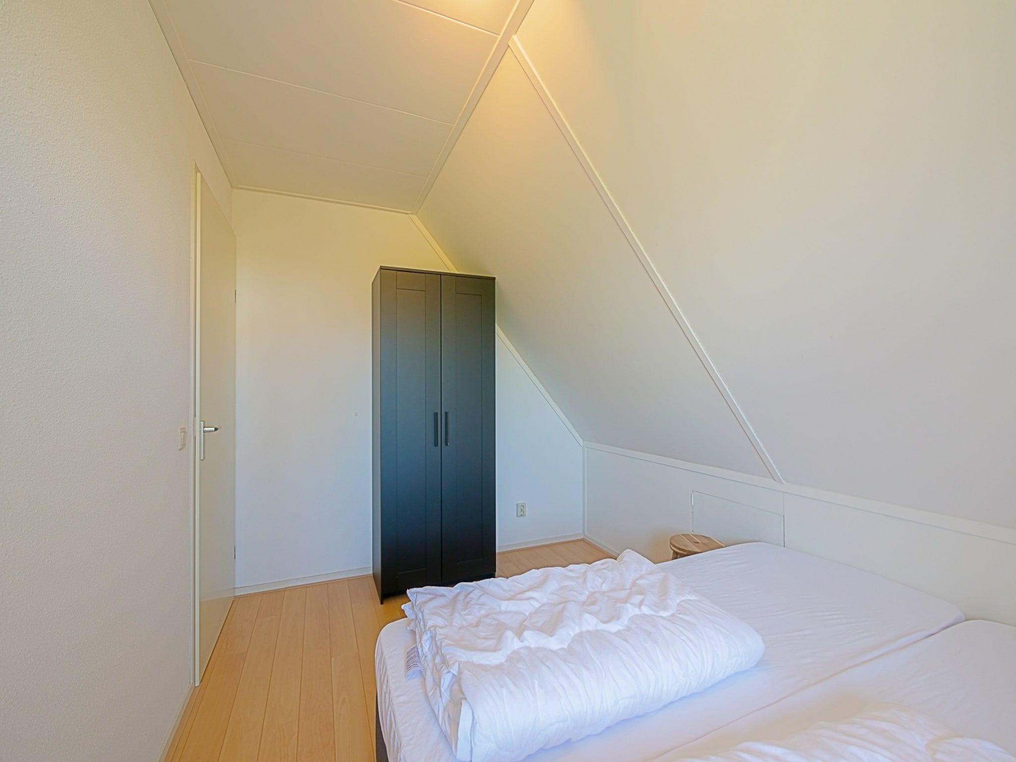 Een slaapkamer van Villa Noorderzon in Julianadorp