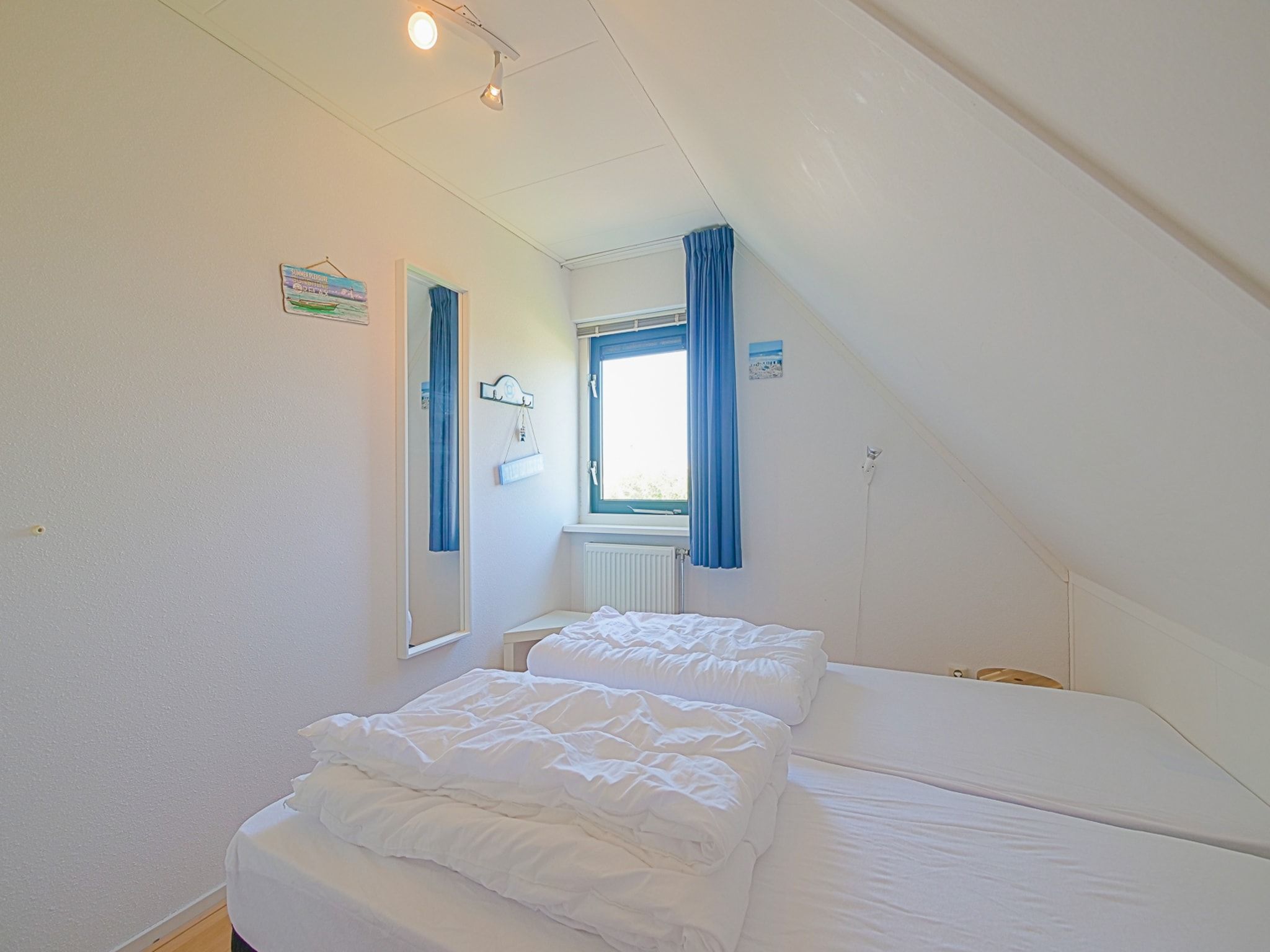 Een slaapkamer van Villa Noorderzon in Julianadorp