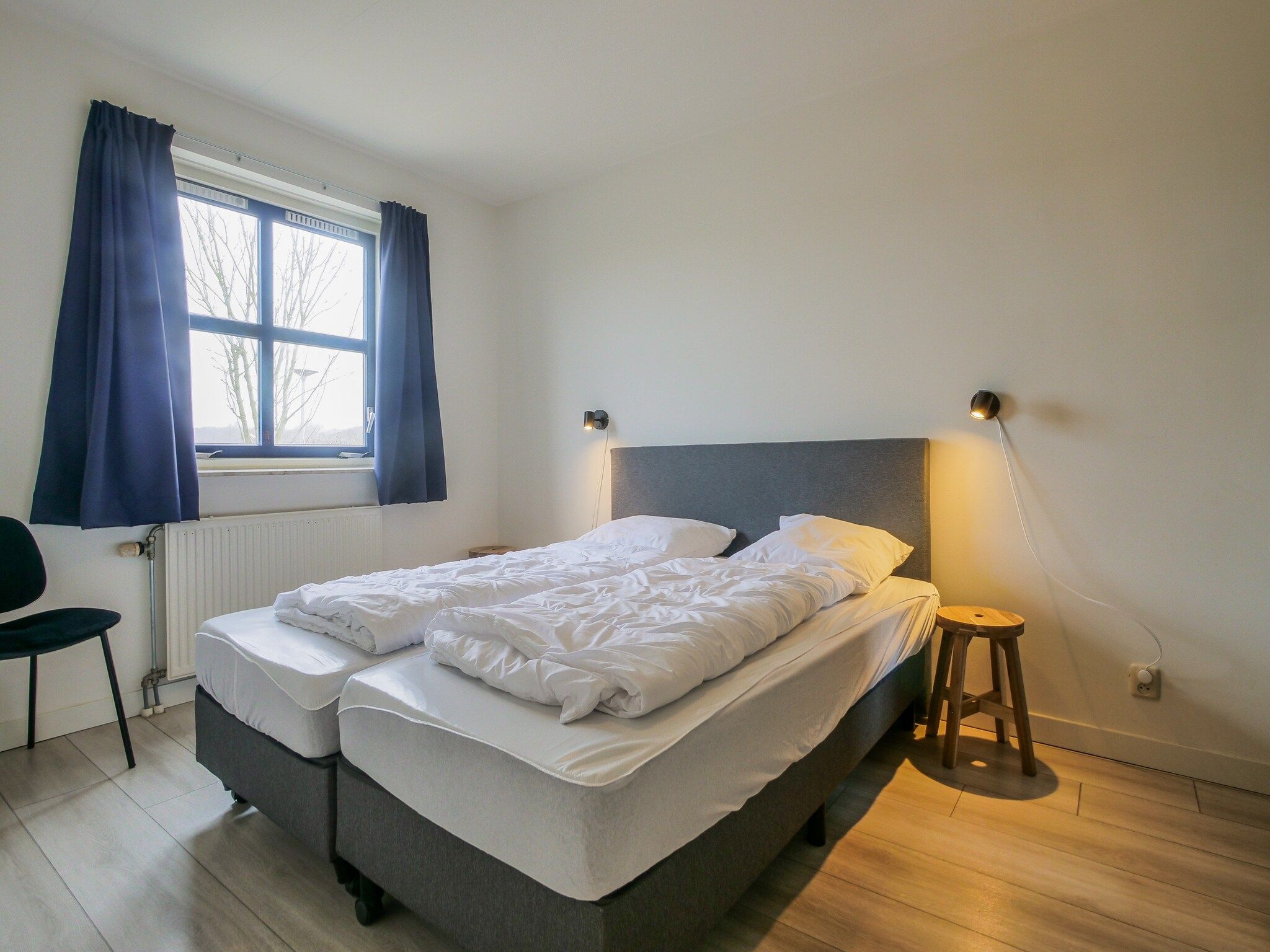Een slaapkamer van Ooghduyne Villa Opduin in Julianadorp