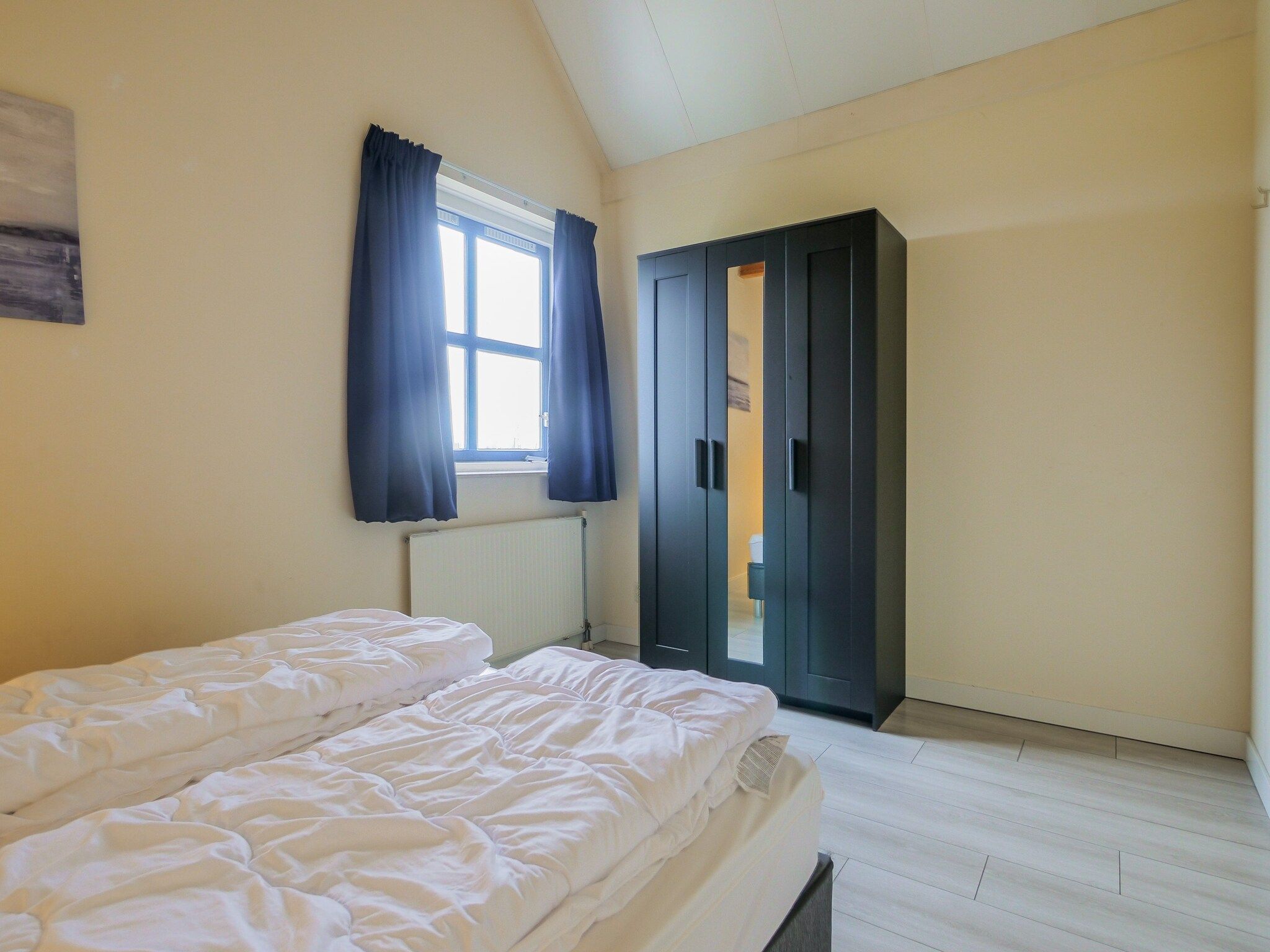 Een slaapkamer van Ooghduyne Villa Opduin in Julianadorp