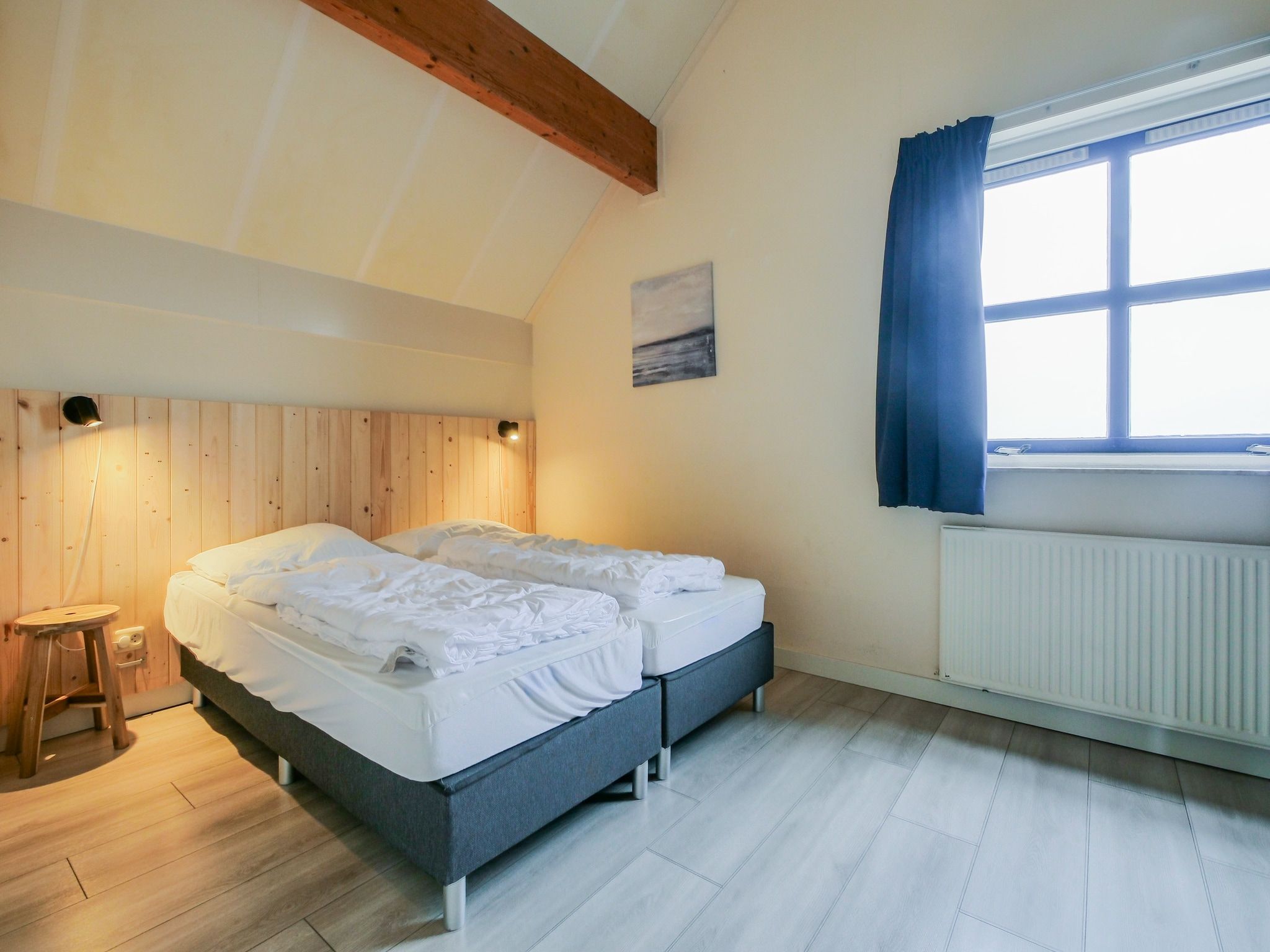 Een slaapkamer van Ooghduyne Villa Opduin in Julianadorp