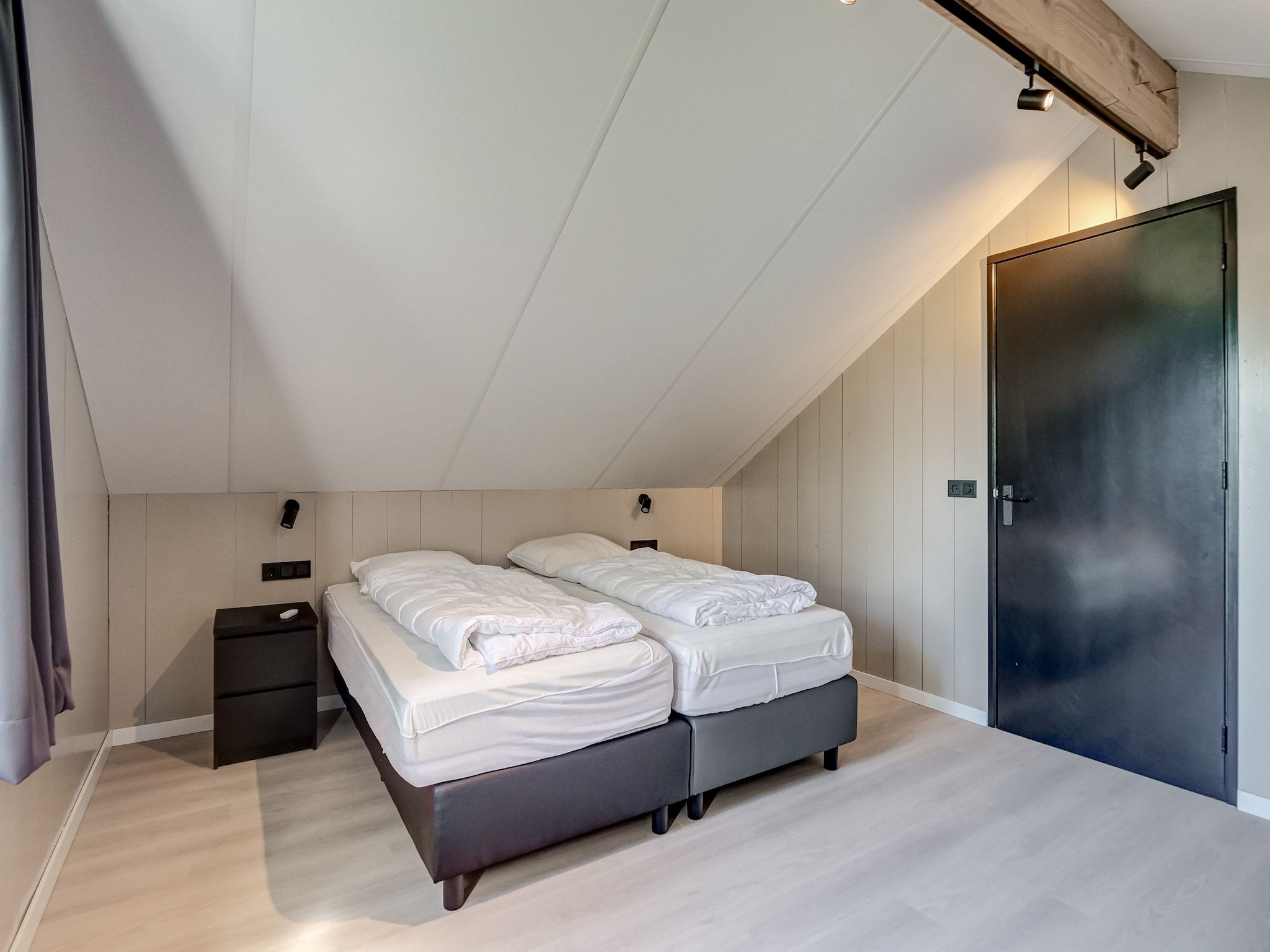 Een slaapkamer van Huis Zee in Julianadorp