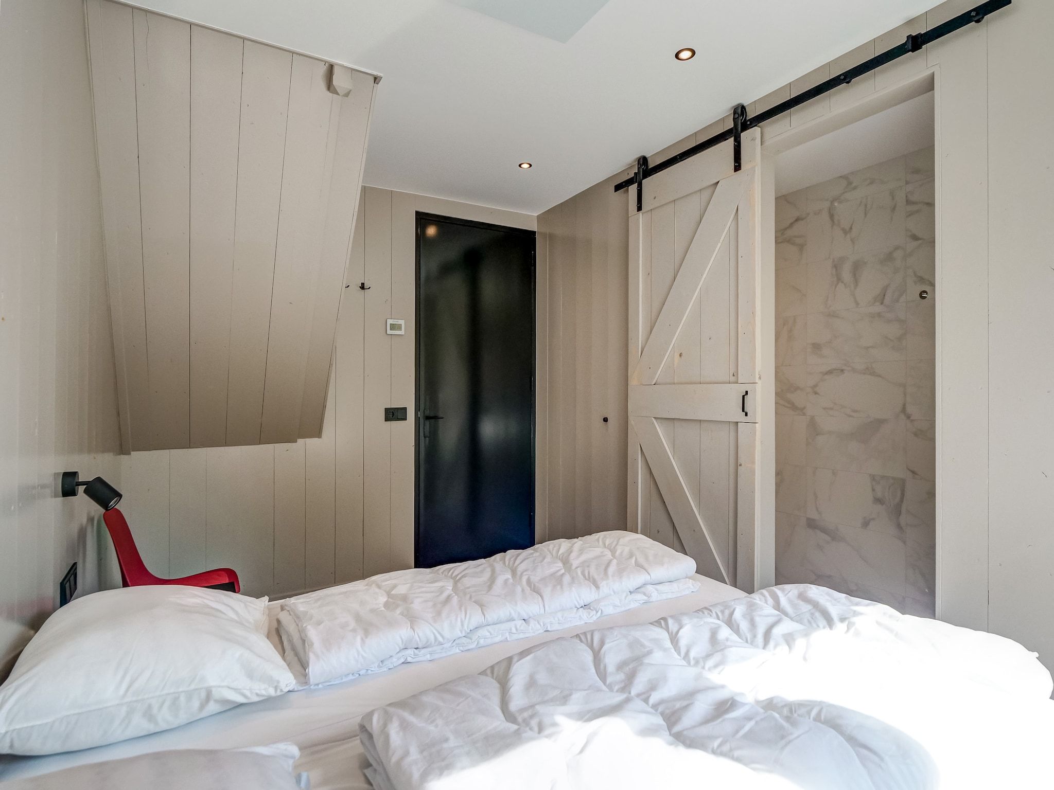 Een slaapkamer van Huis Zee in Julianadorp