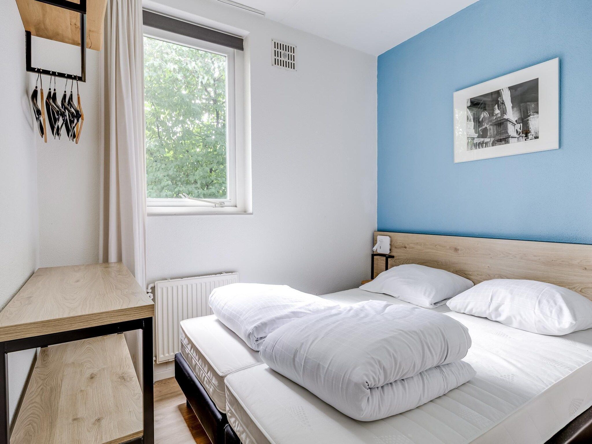Een slaapkamer van 7 - Persoons Forest 217 Sauna Bungalow (copy) in Ewijk