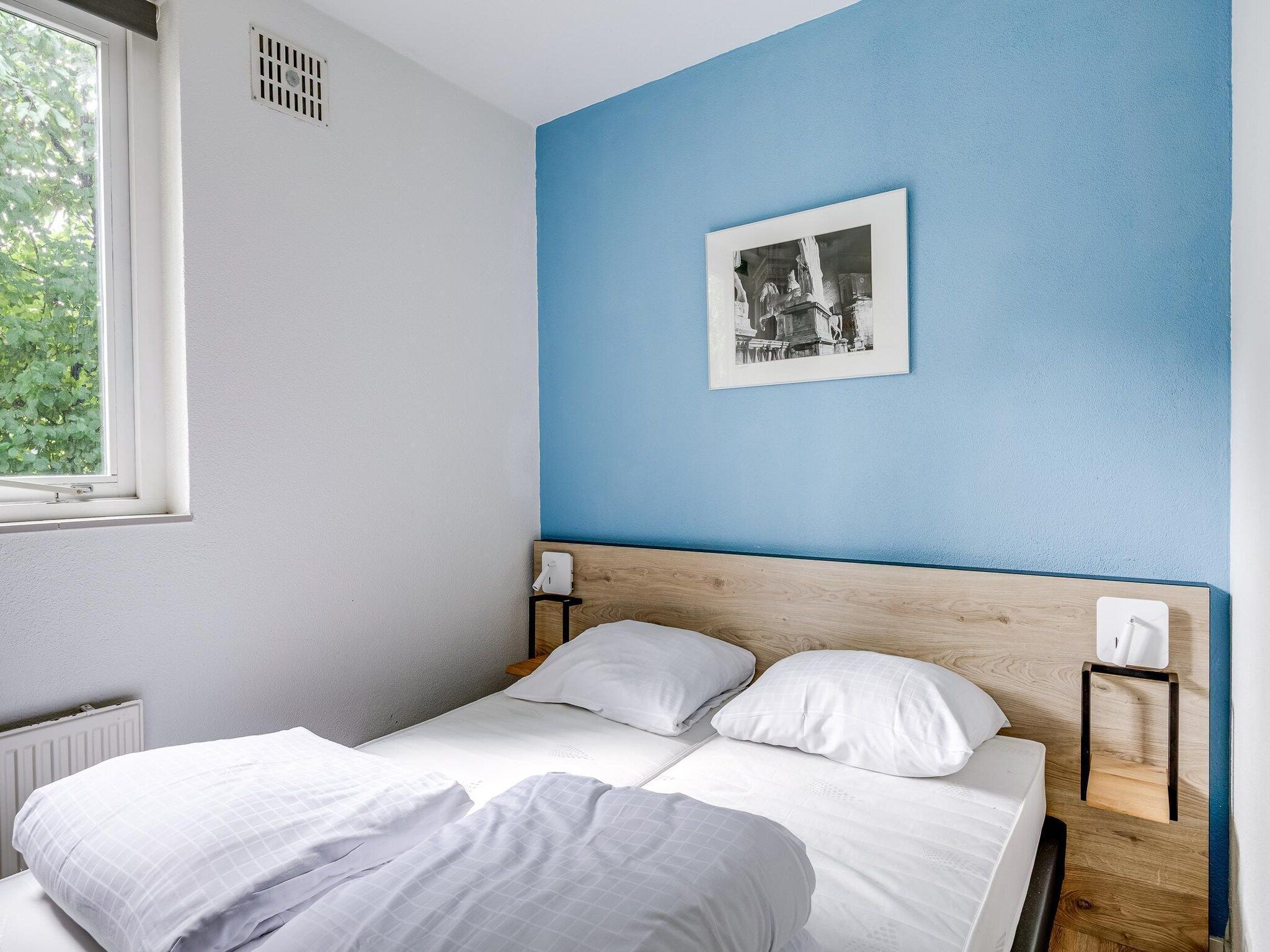 Een slaapkamer van 7 - Persoons Forest 217 Sauna Bungalow (copy) in Ewijk