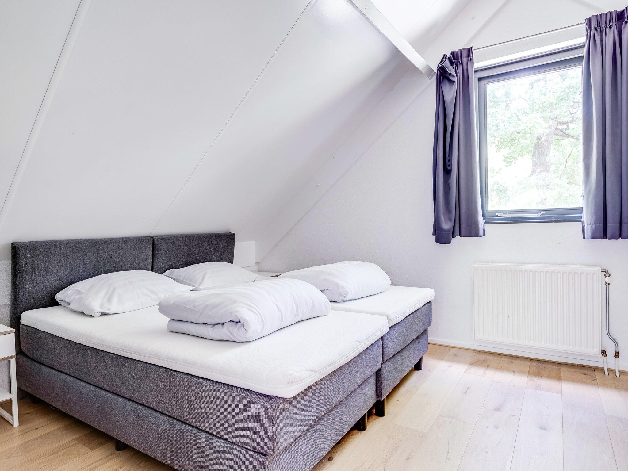 Een slaapkamer van 6 - Persons De Zingende Wilg (copy) (copy) (copy) in Ewijk