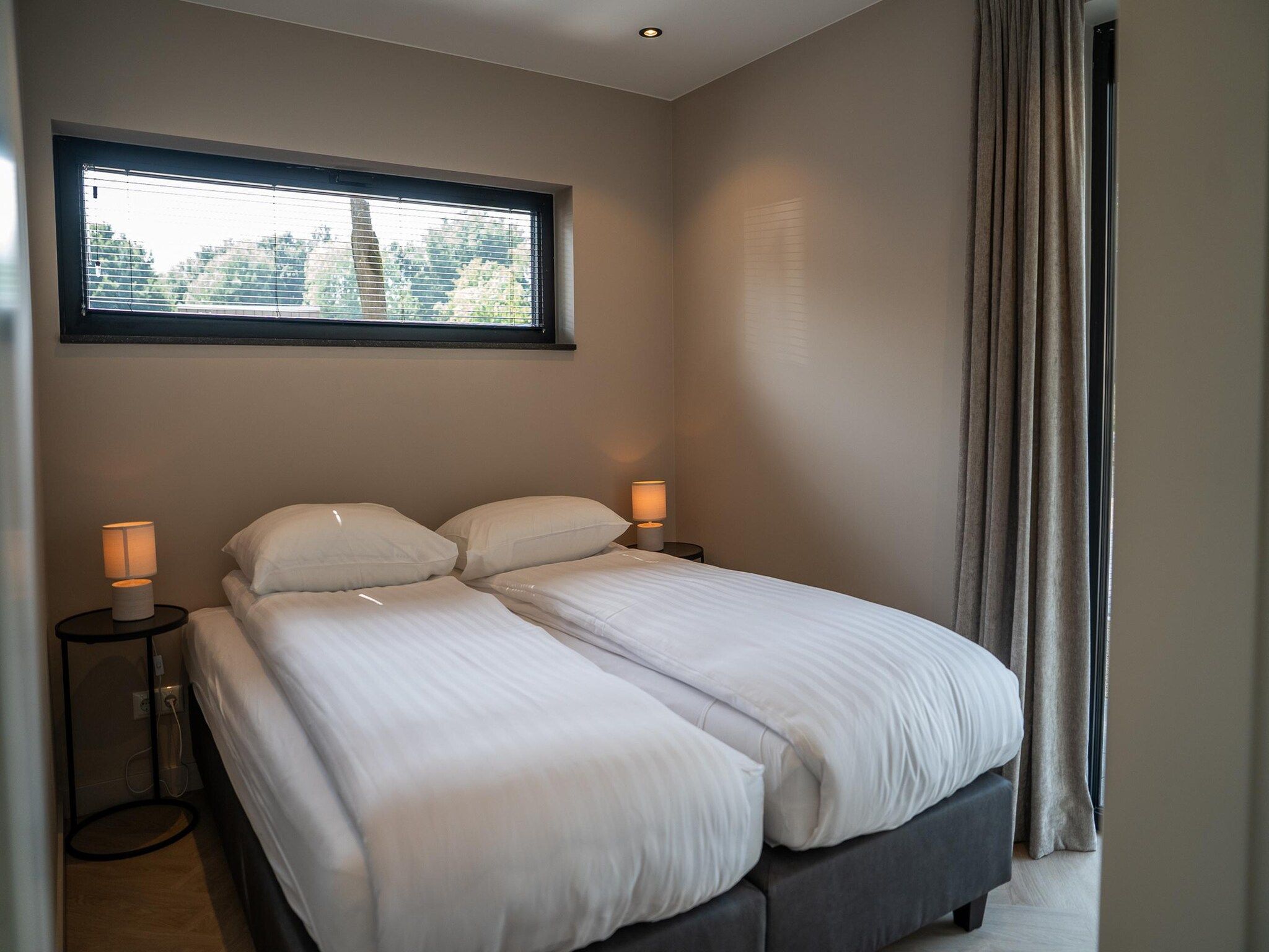 Een slaapkamer van Ecovilla Waterzicht  6 people Luxe in Oirschot