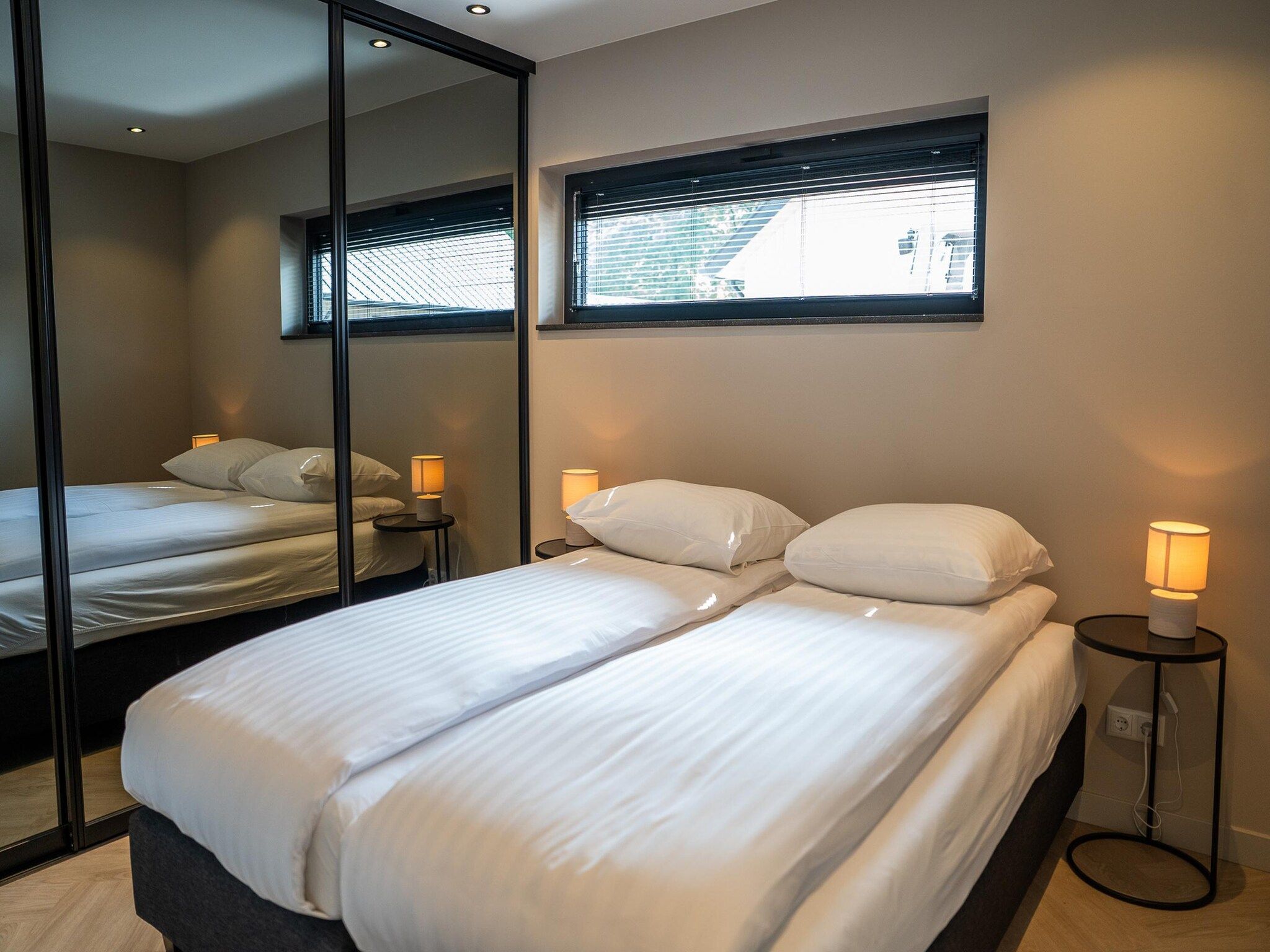 Een slaapkamer van Ecovilla Waterzicht  6 people Luxe in Oirschot
