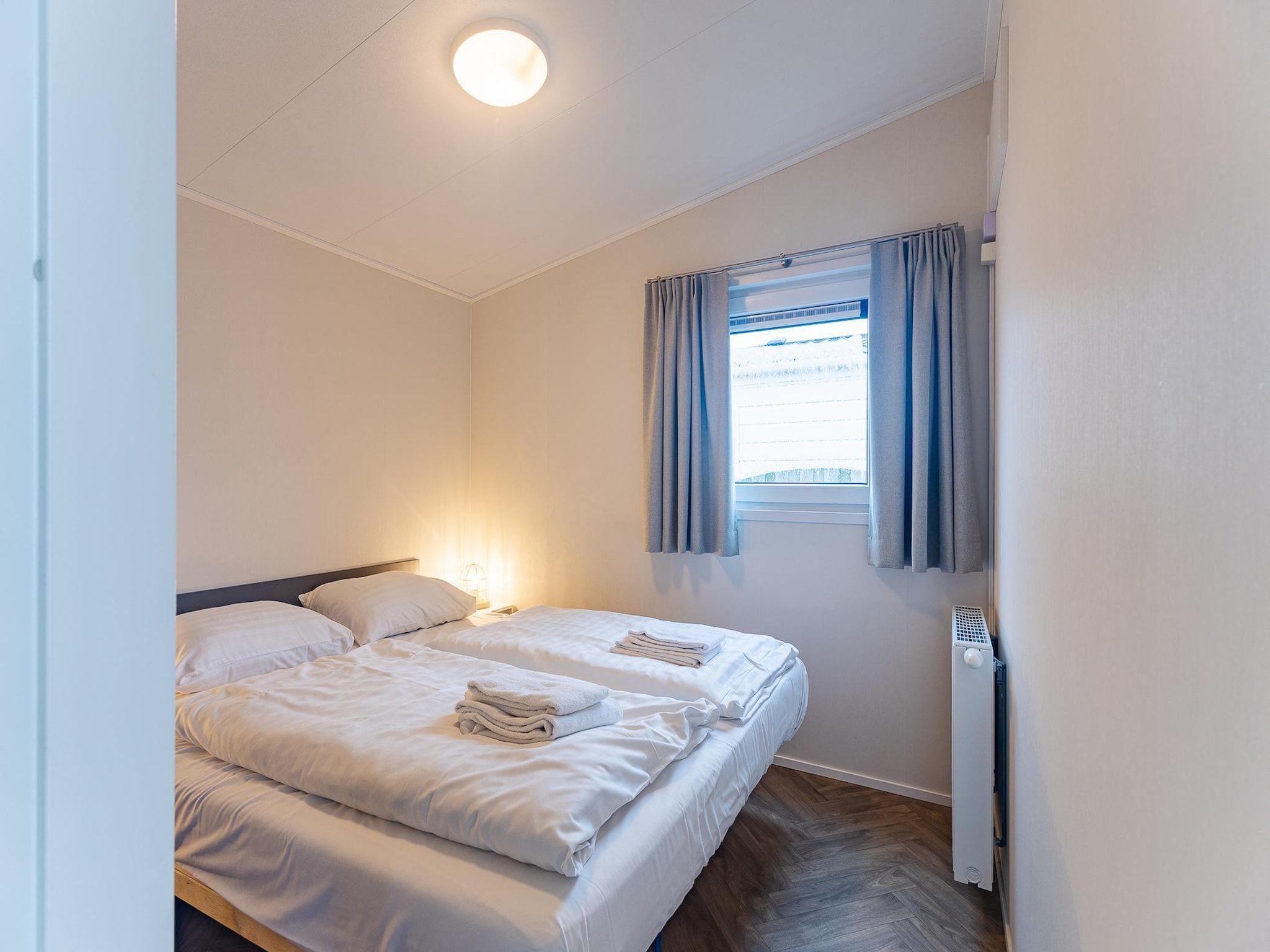 Een slaapkamer van Duinhoeve chalet Schelp in Burgh-Haamstede