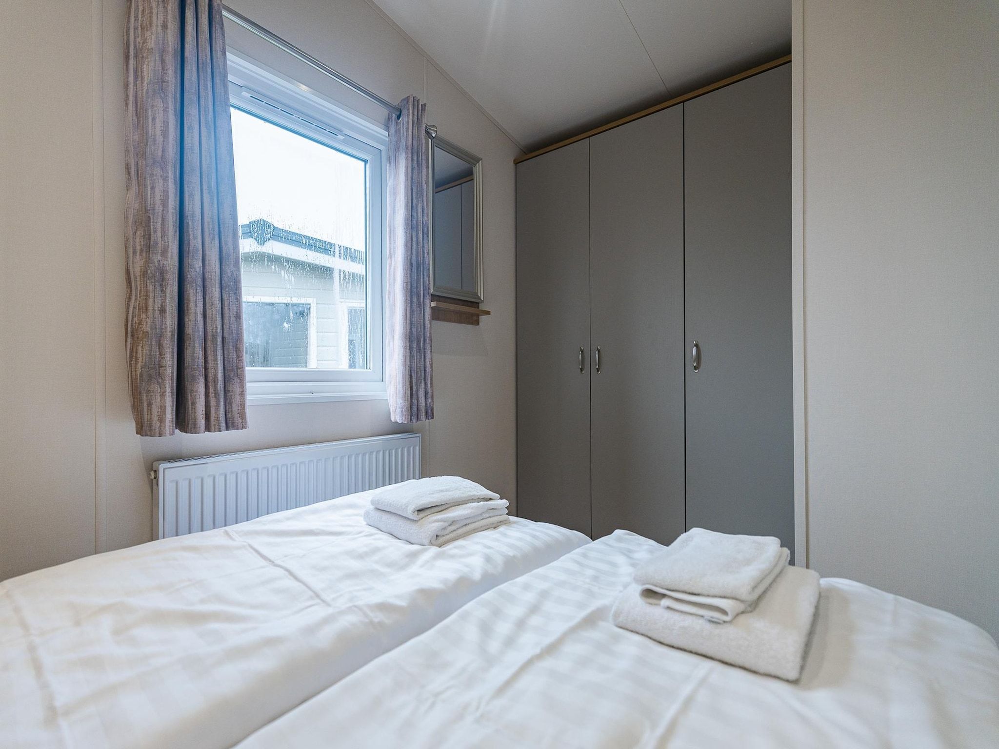 Een slaapkamer van Duinhoeve Chalet Vogel - Huisdier niet toegestaan in Burgh-Haamstede