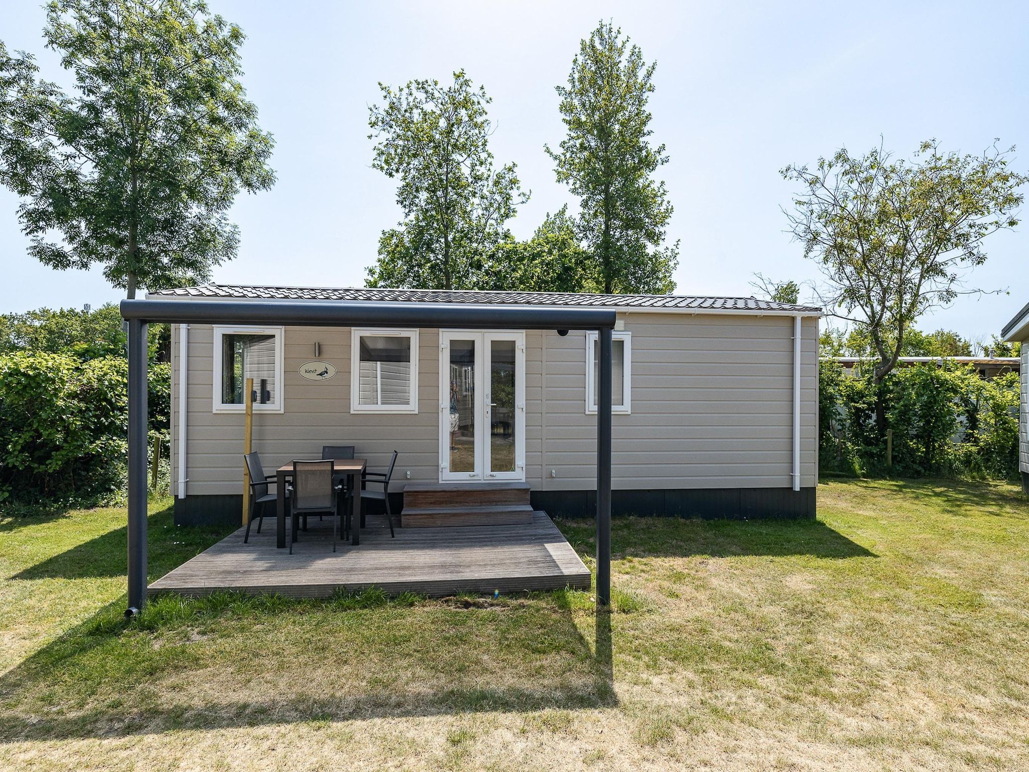 De buitenkant van Duinhoeve Chalet Vogel - Huisdier niet toegestaan in Burgh-Haamstede