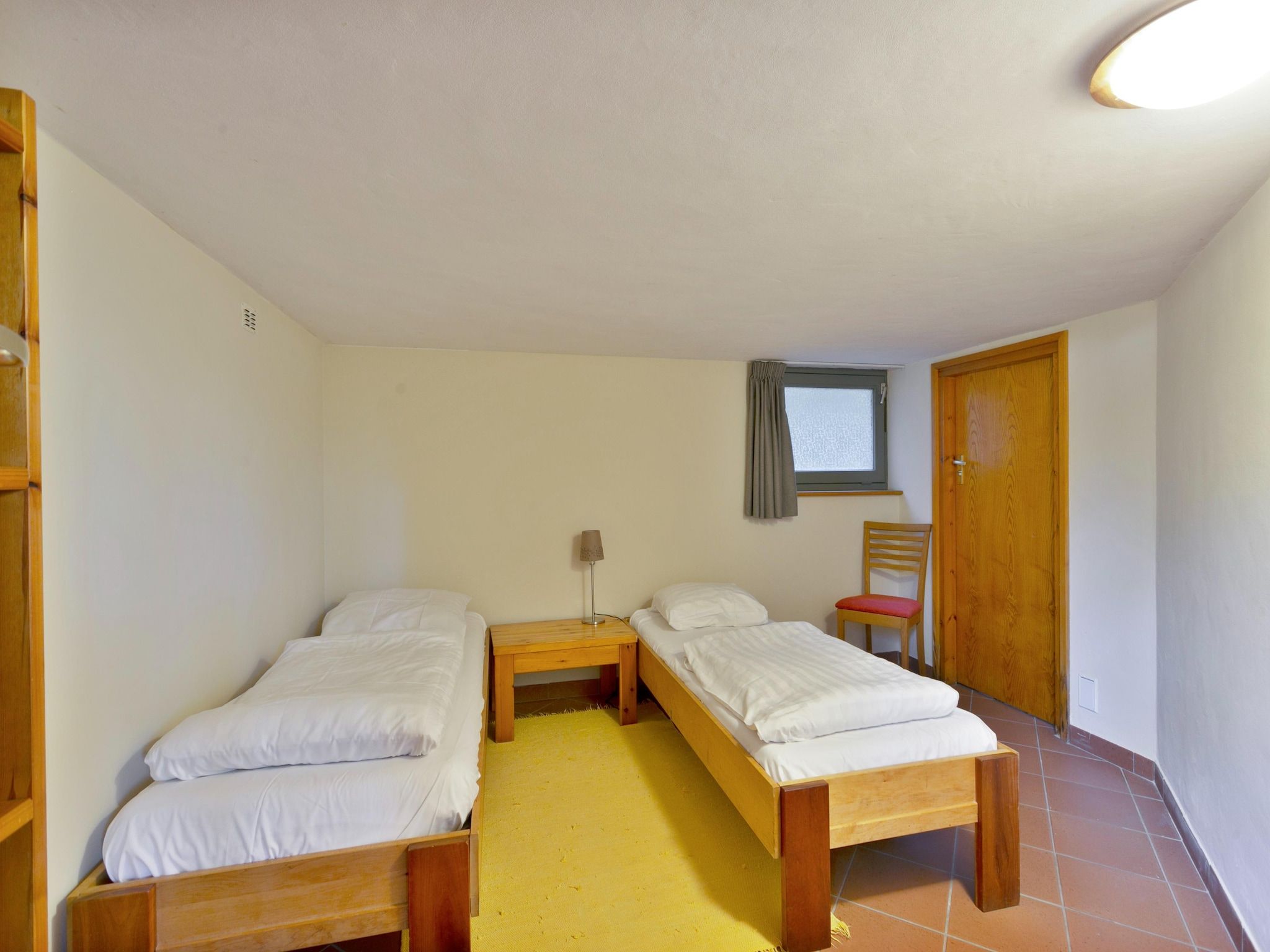 Een slaapkamer van Vakantiepark Herperduin 6 in Herpen