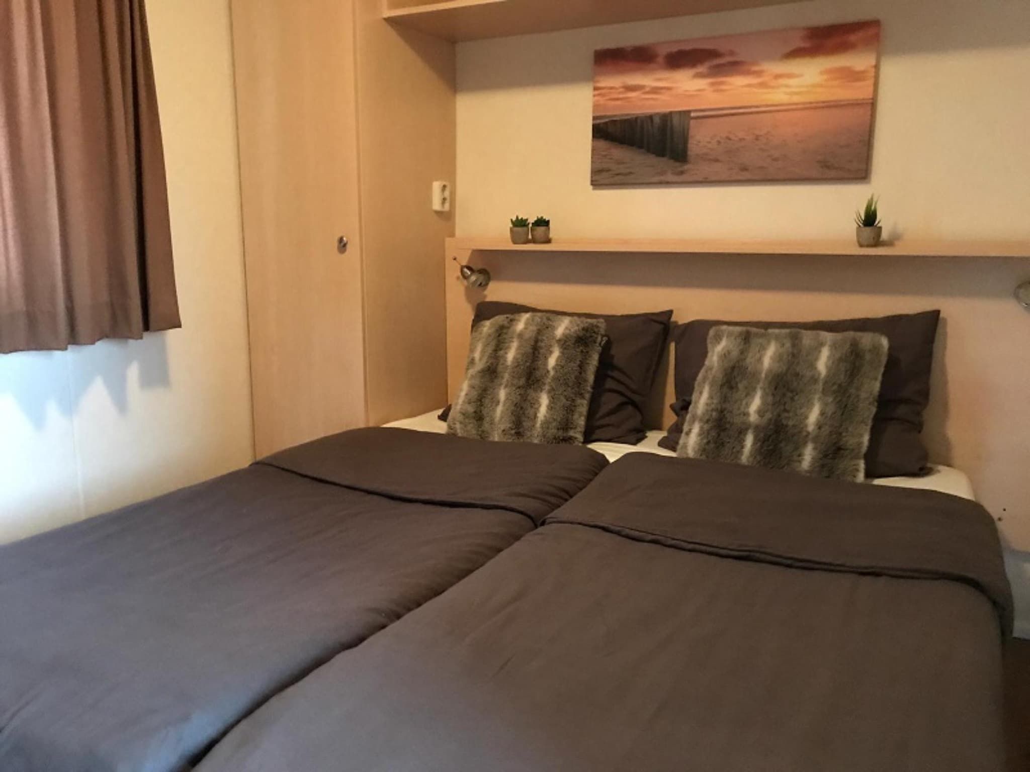 Een slaapkamer van Duinchalet in Hollum