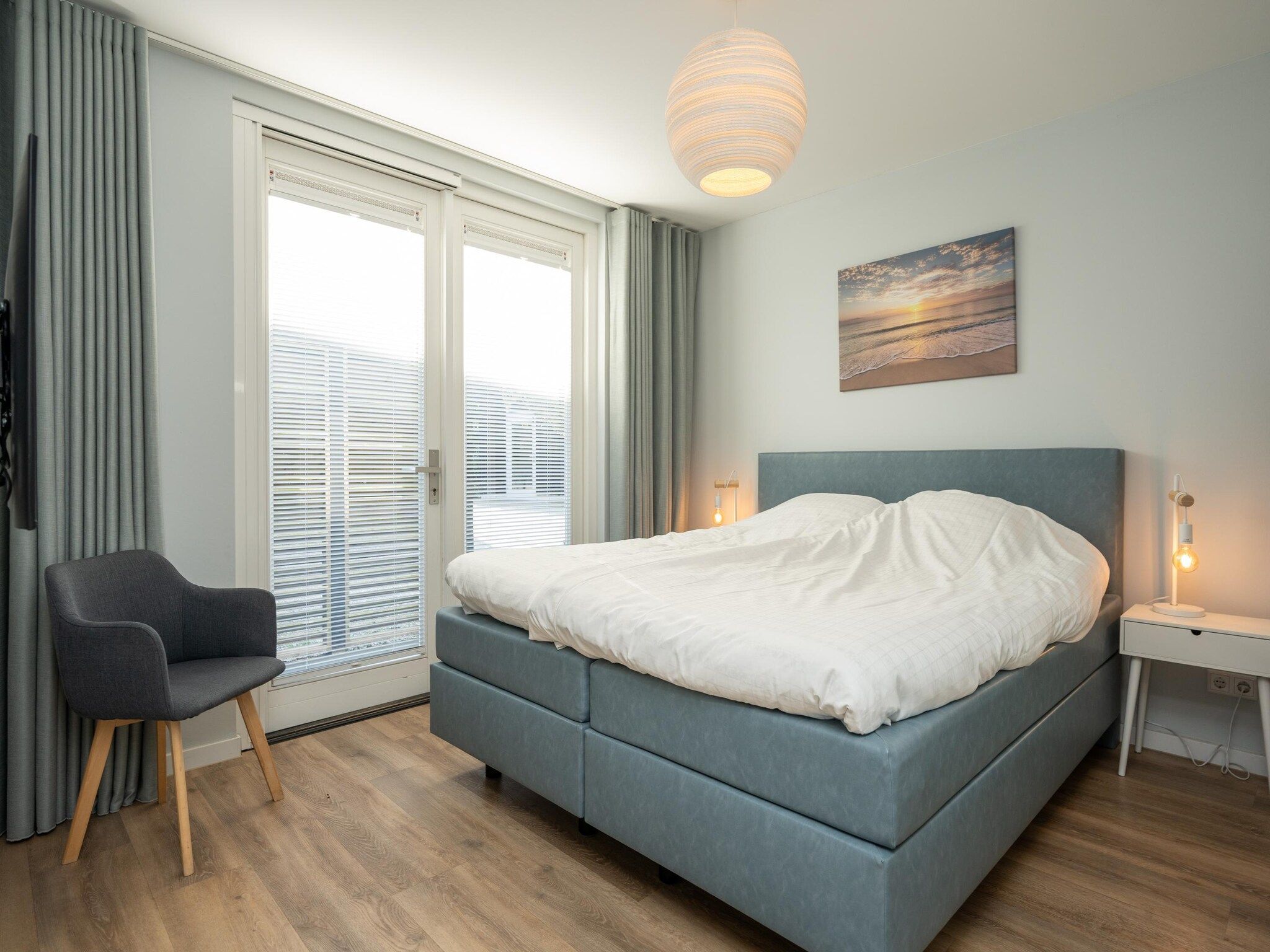 Een slaapkamer van Mienterbos-Duinglop in De Koog