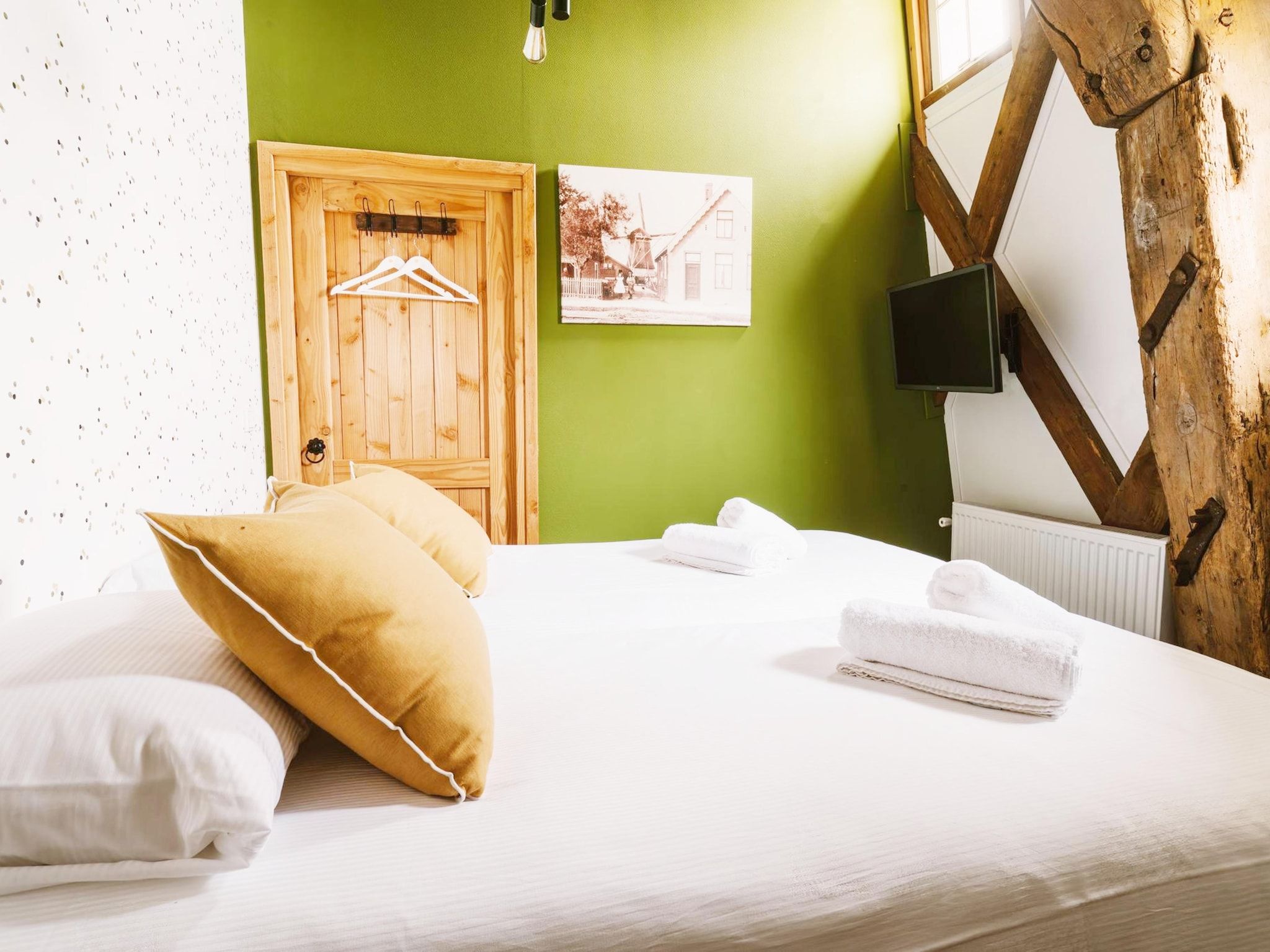Een slaapkamer van De Molen van Egmond in Egmond aan den Hoef