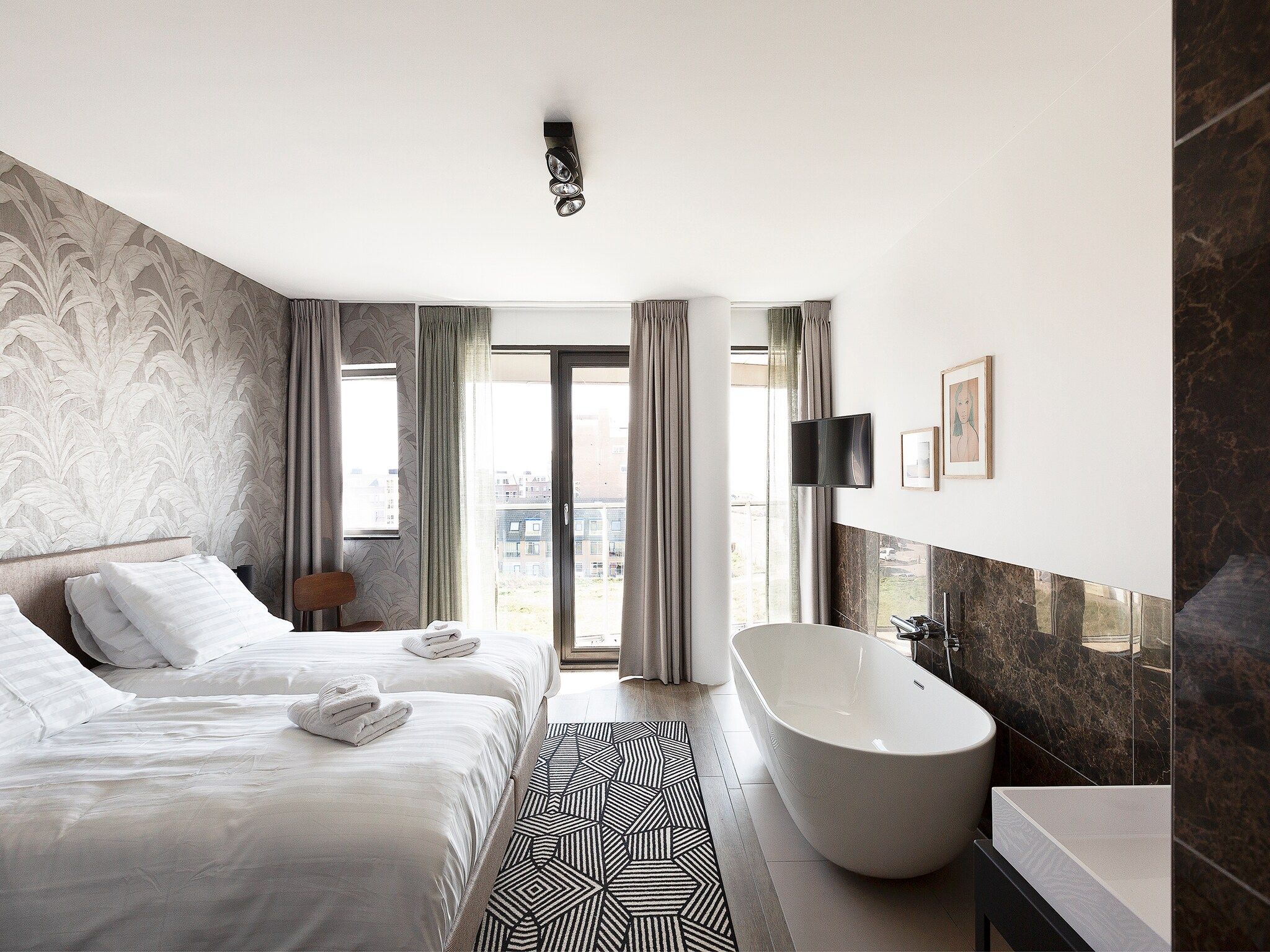 Een slaapkamer van Droomsuites Egmond aan Zee - 8 person apartment in Egmond aan Zee