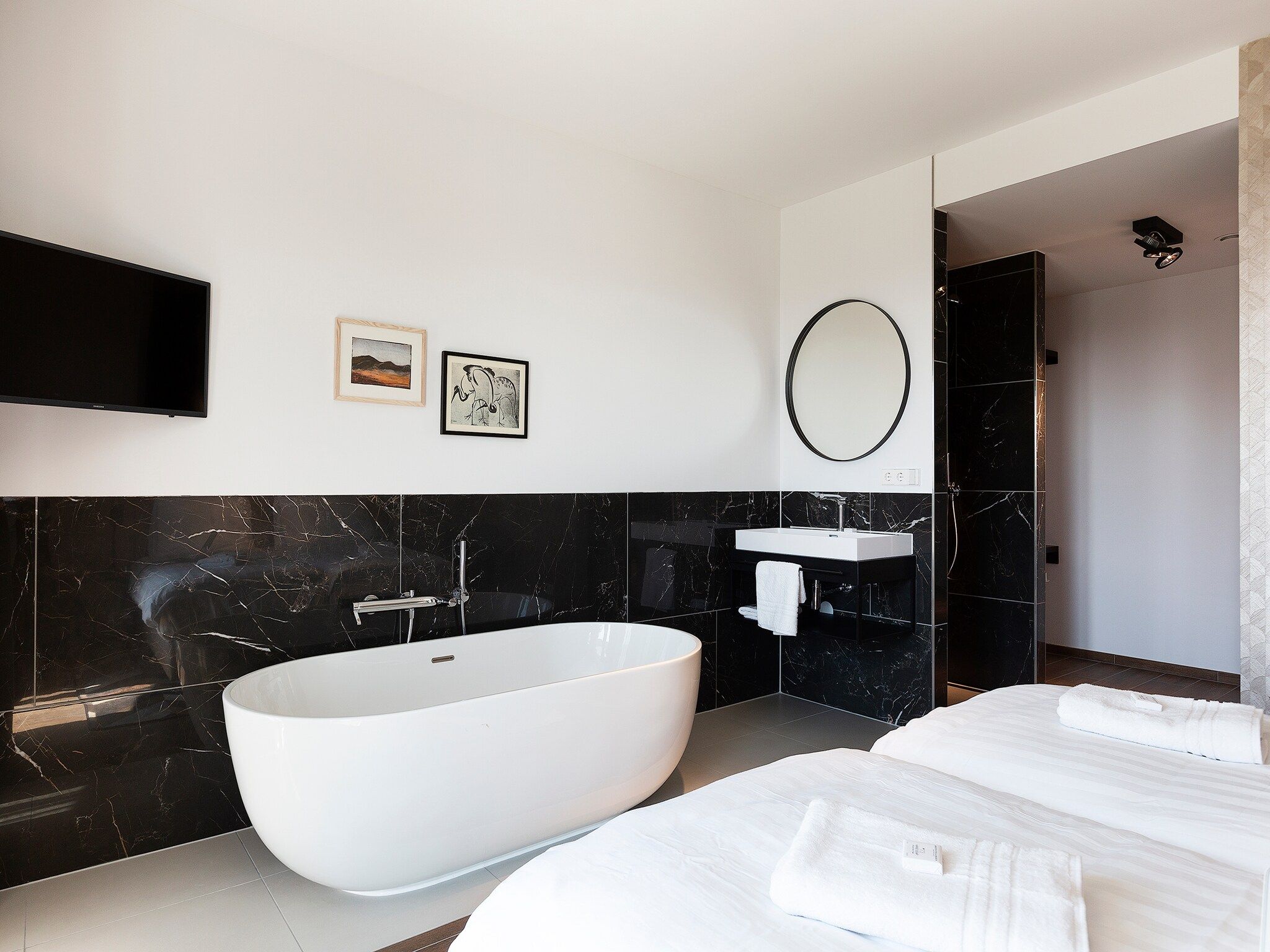 Een slaapkamer van Droomsuites Egmond aan Zee - 8 person apartment in Egmond aan Zee