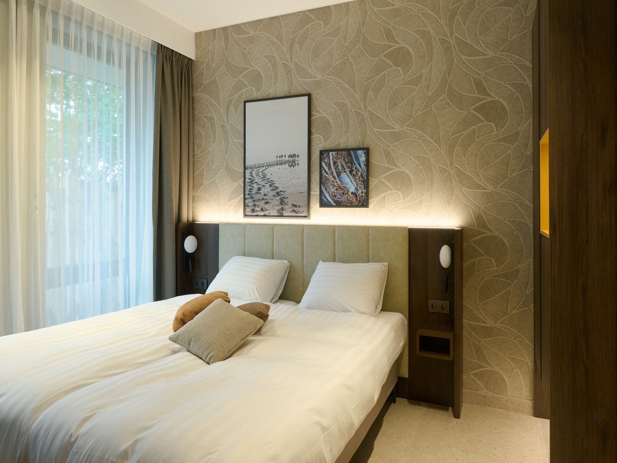 Een slaapkamer van Droomsuites Texel - 4 persoons appartement in Den Burg