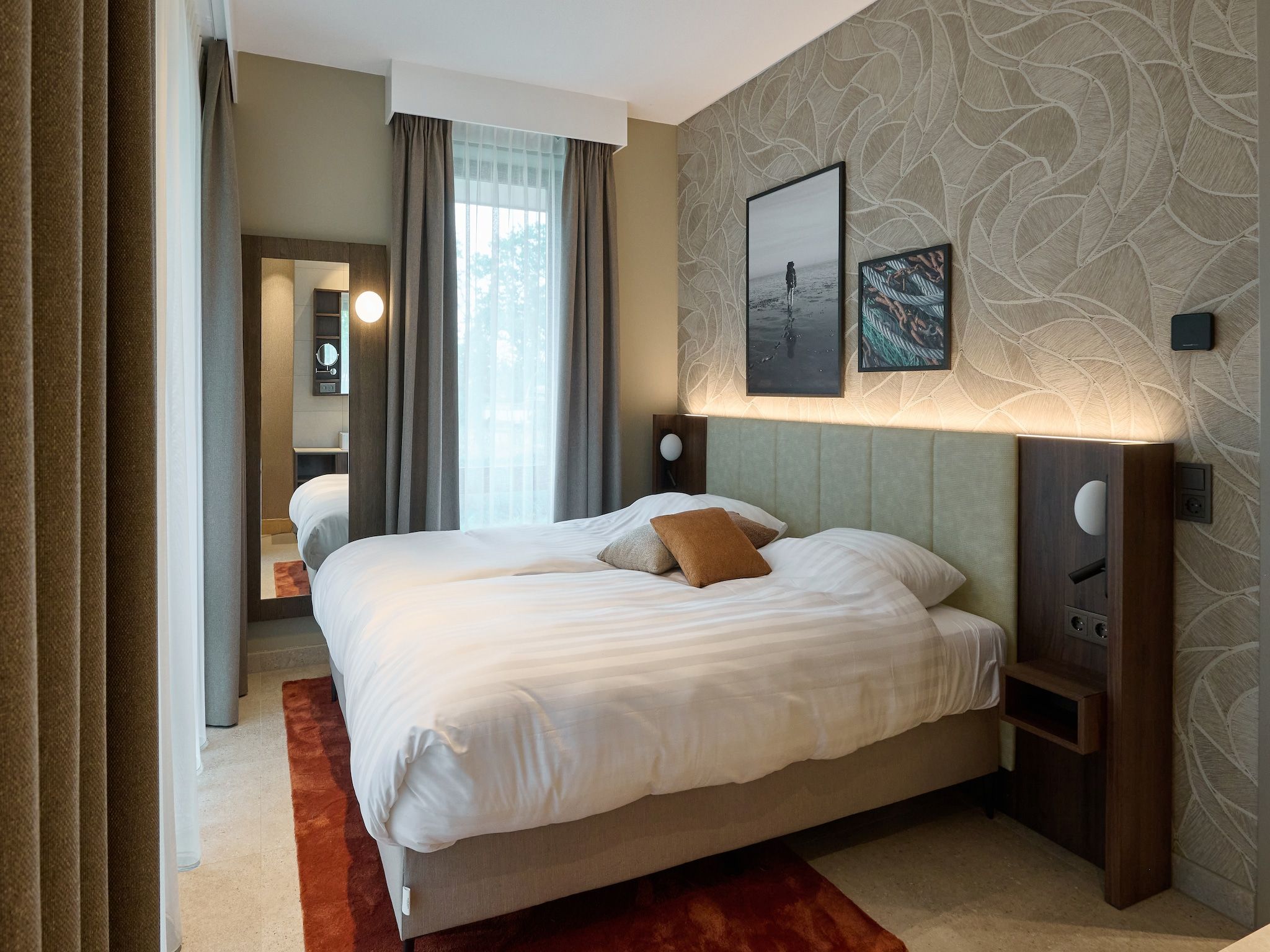 Een slaapkamer van Droomsuites Texel - 4 persoons appartement in Den Burg