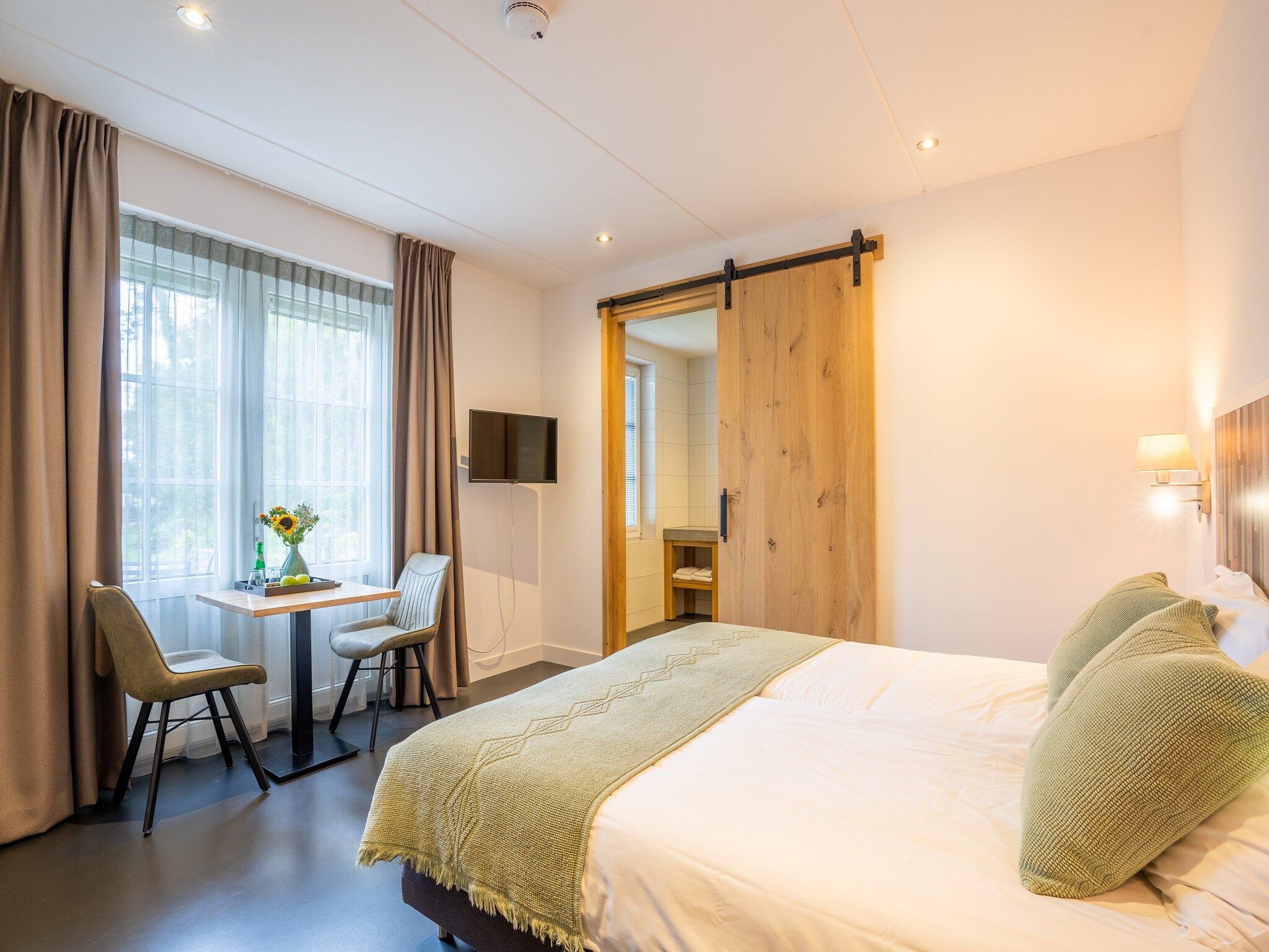 Een slaapkamer van Duynweelde Texel in Den Burg