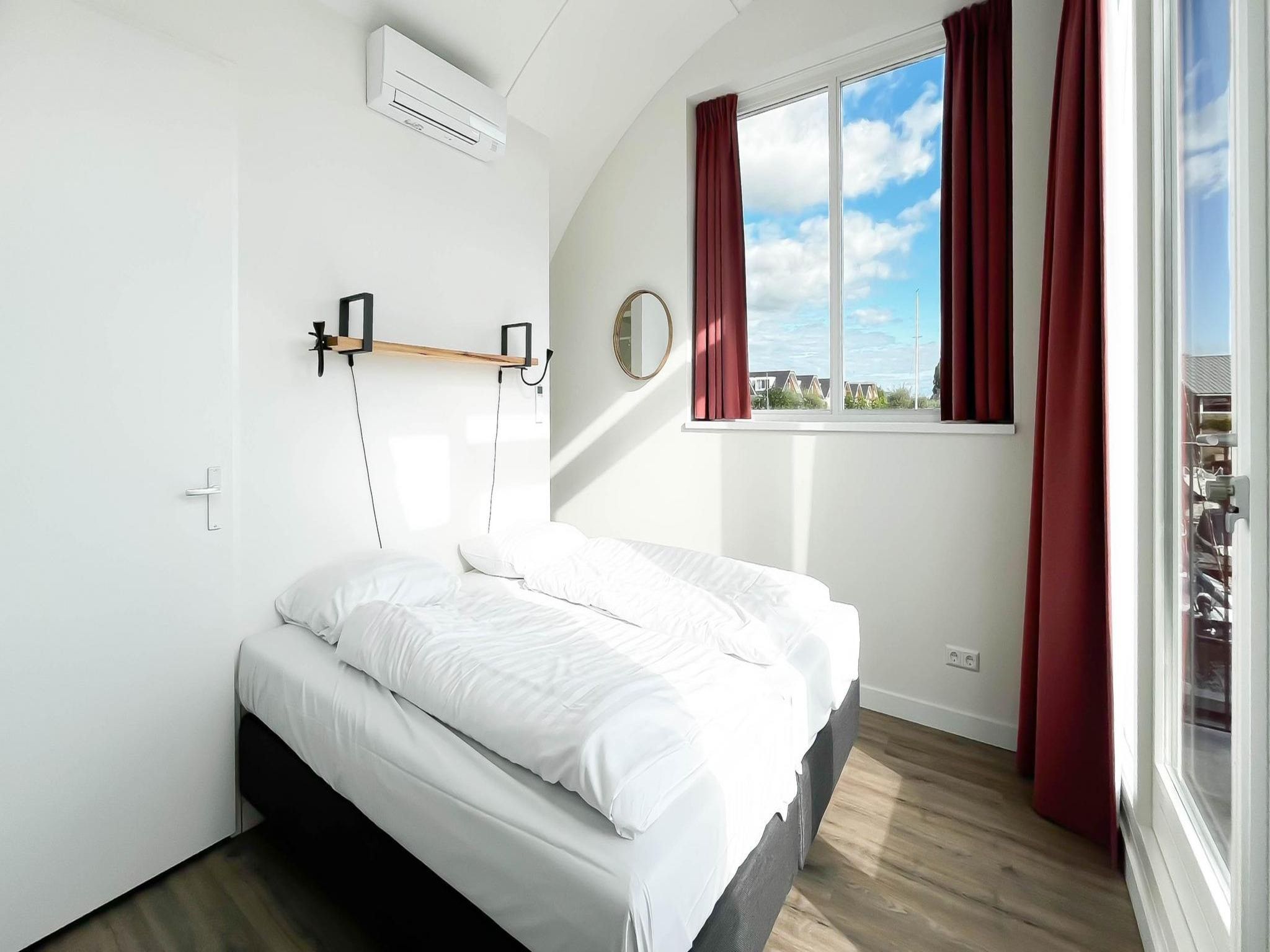 Een slaapkamer van Havenzicht in Uitgeest