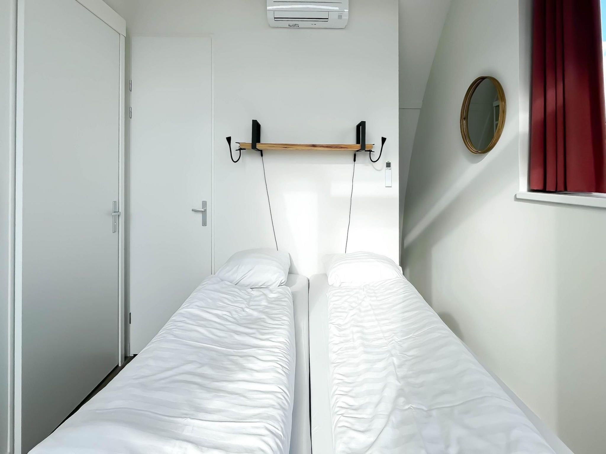 Een slaapkamer van Havenzicht in Uitgeest