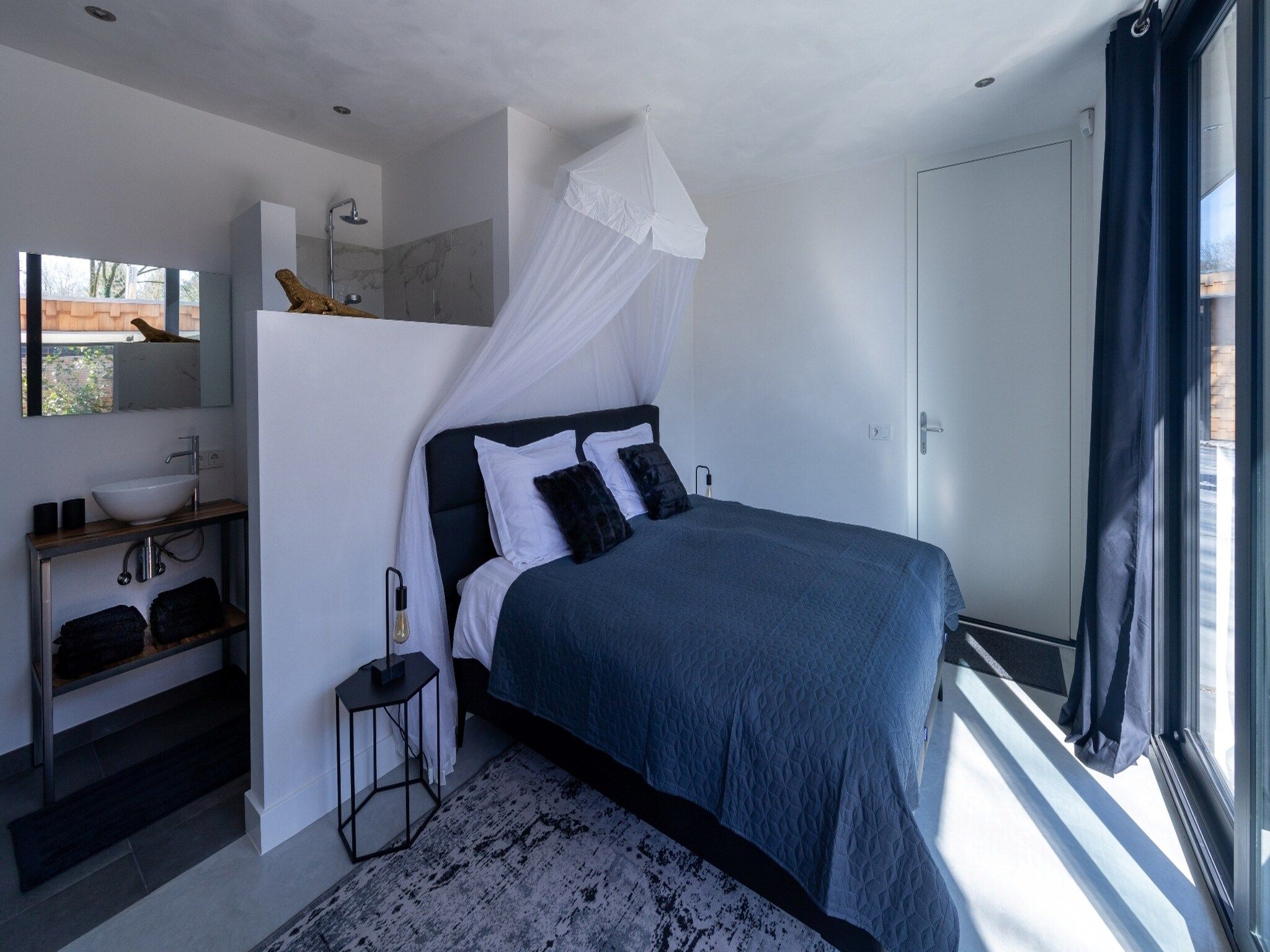 Een slaapkamer van Houten Boshuis in Oosterhout