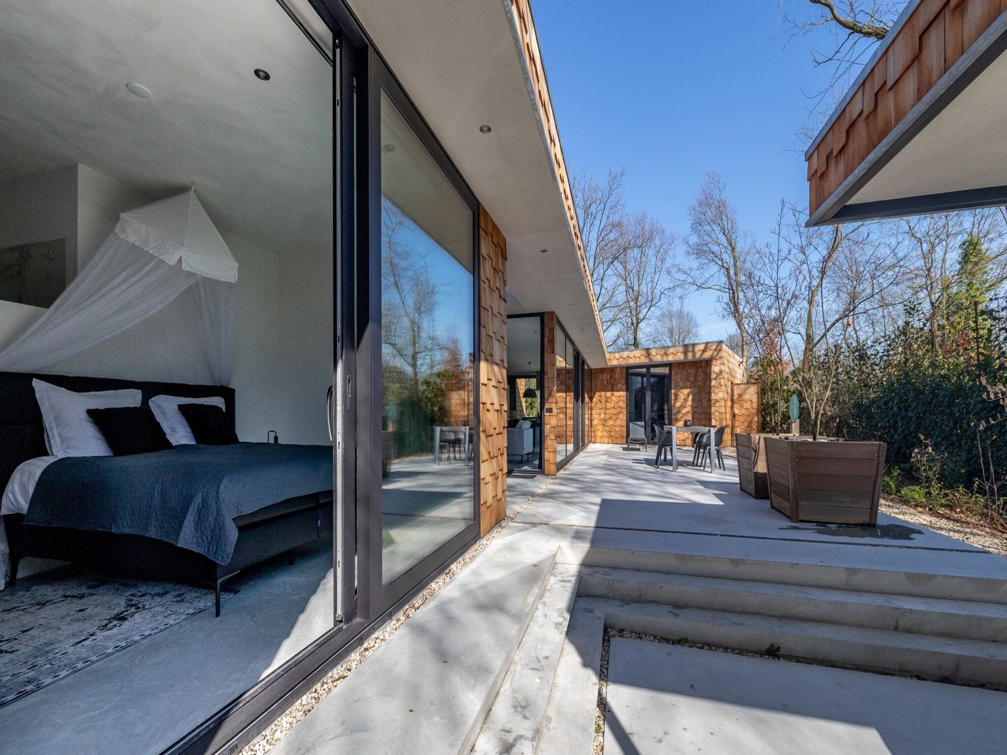 Een slaapkamer van Houten Boshuis in Oosterhout