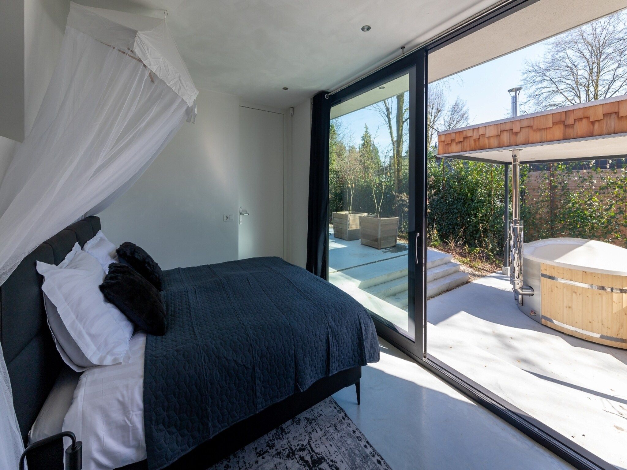 Een slaapkamer van Houten Boshuis in Oosterhout