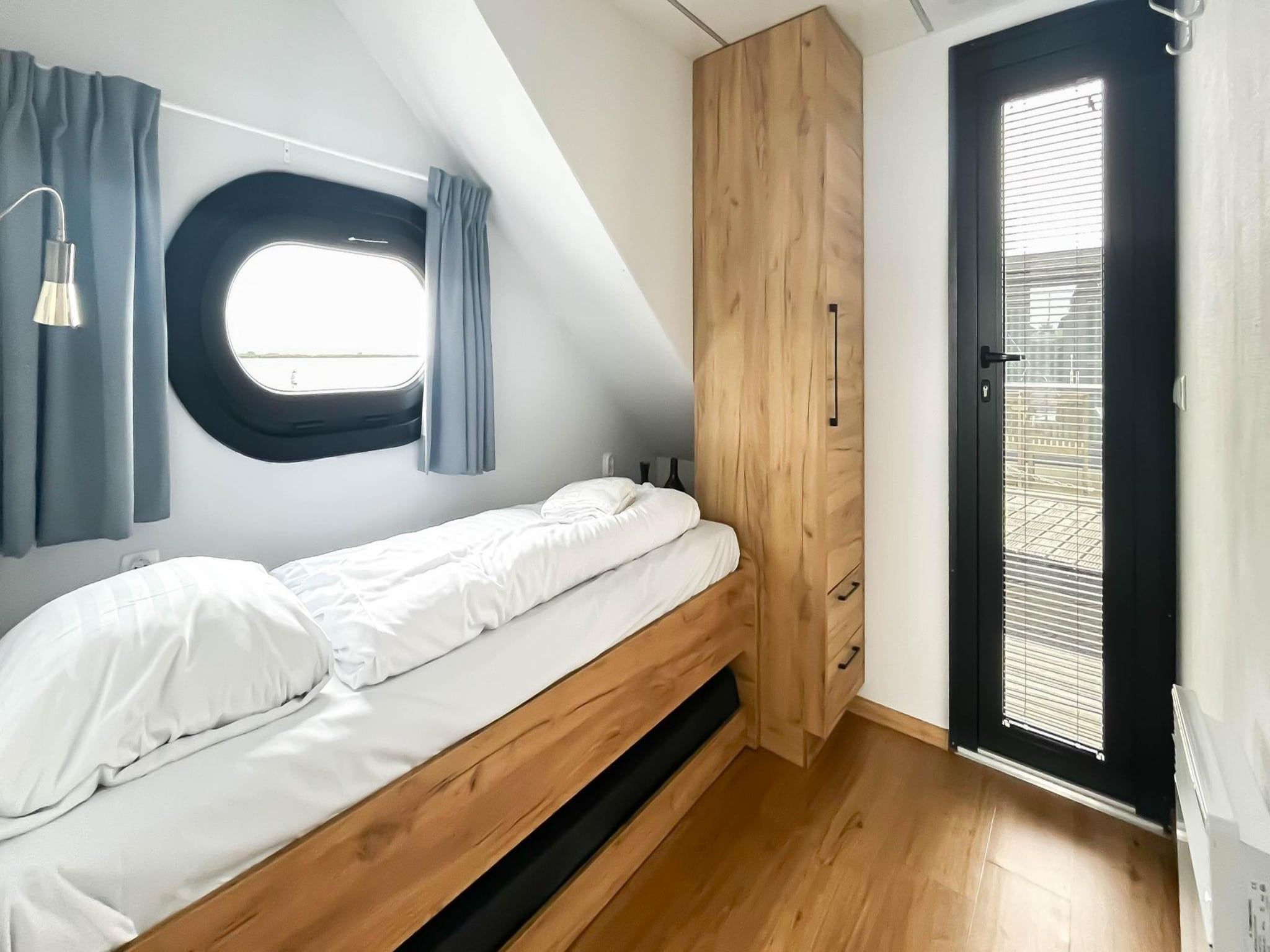 Een slaapkamer van Meerzicht in Uitgeest