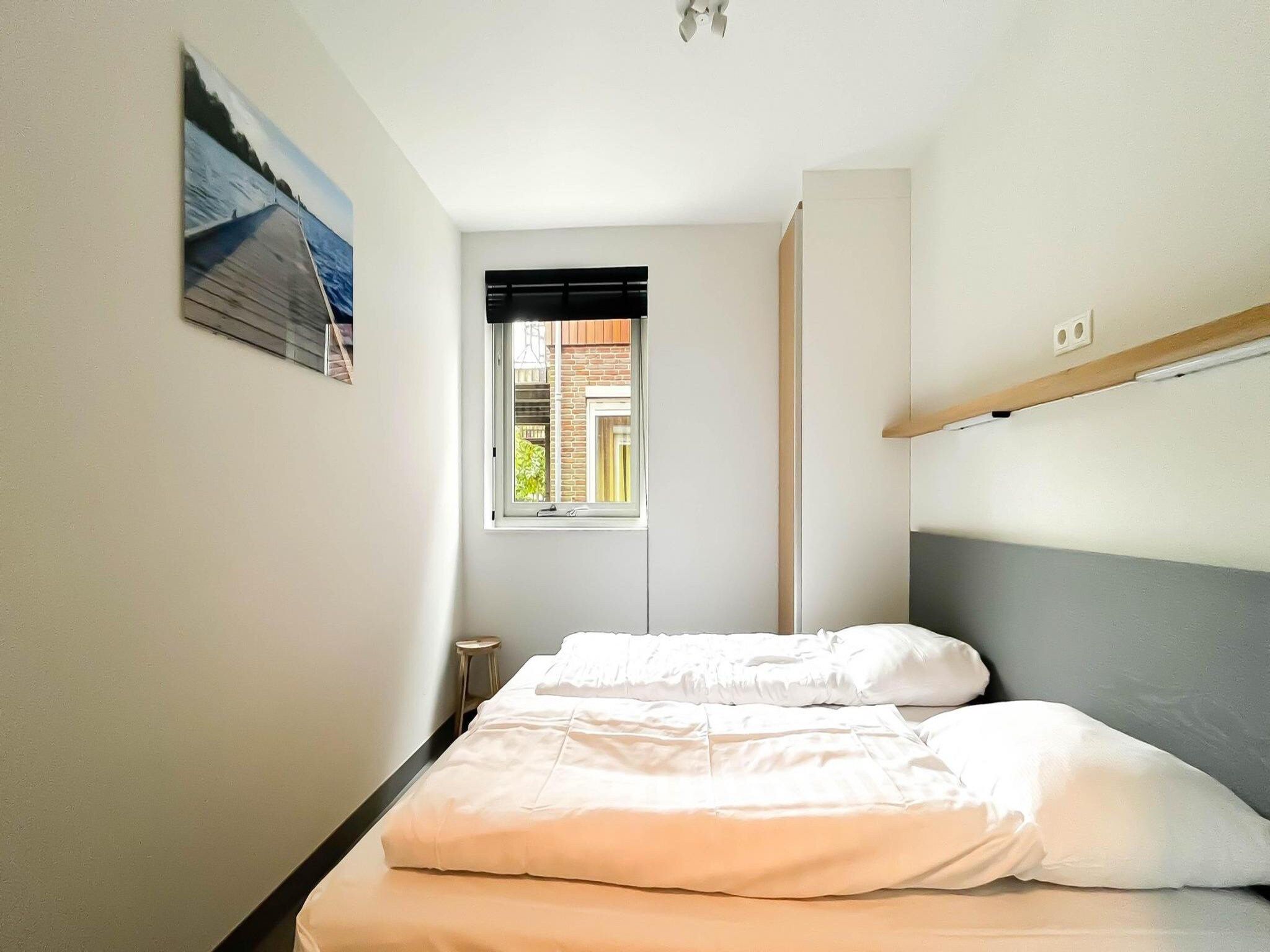 Een slaapkamer van Schelpzicht in Uitgeest