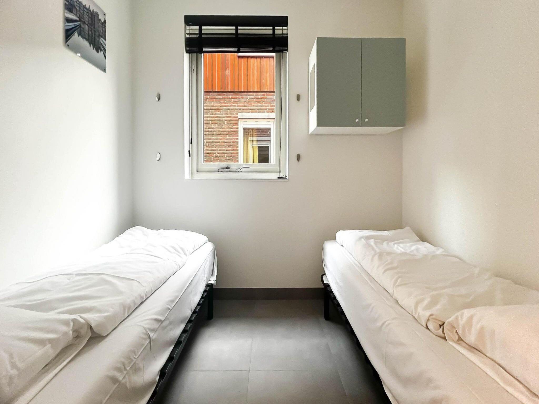 Een slaapkamer van Schelpzicht in Uitgeest