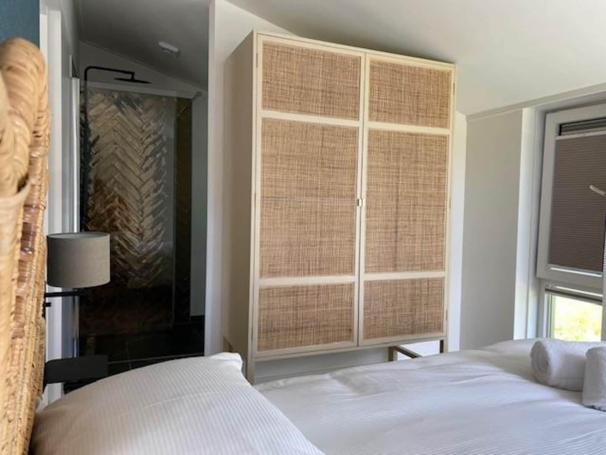 Een slaapkamer van Slapen tussen de duinen - 53 in Sint Maarten