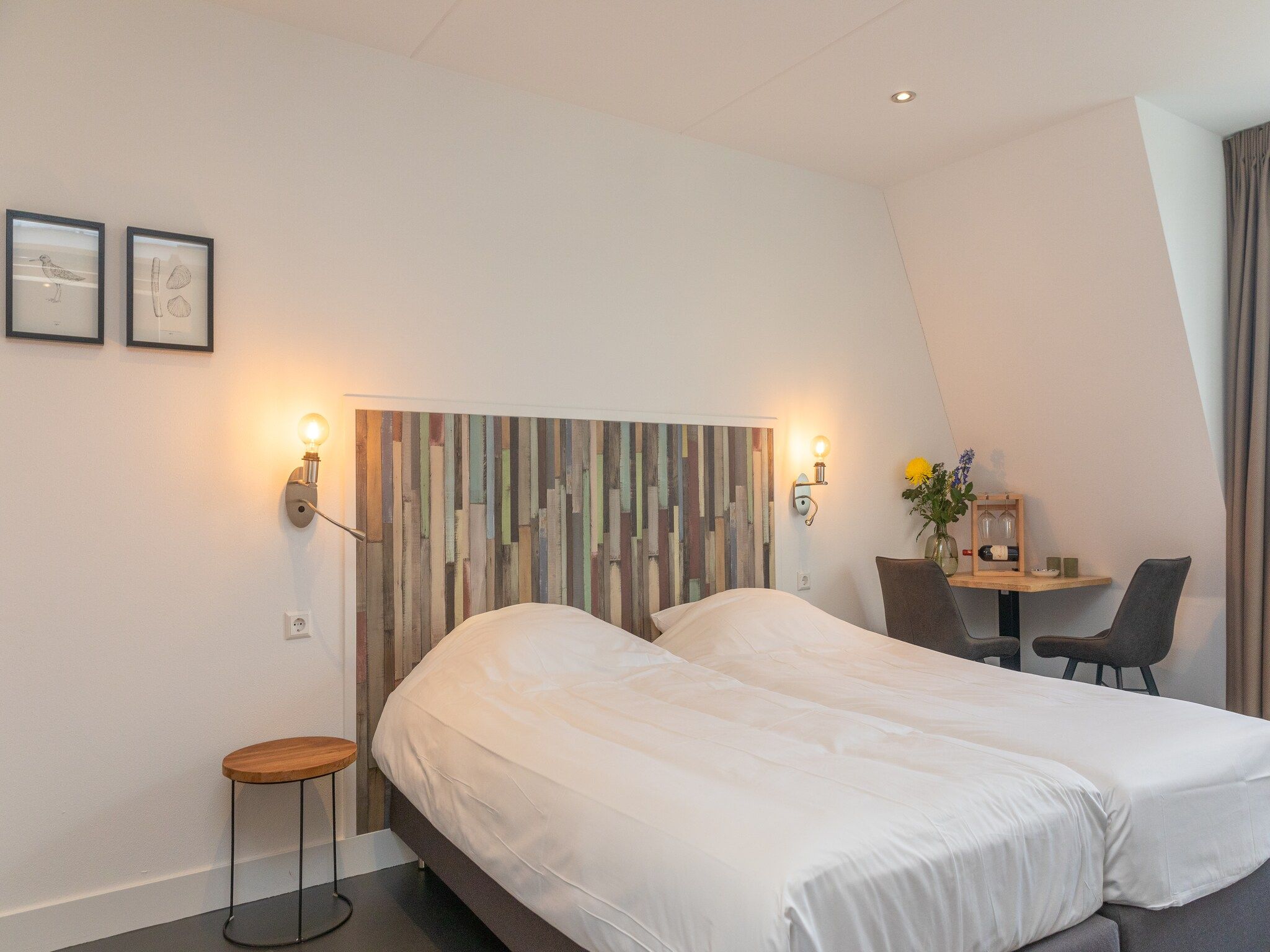 Een slaapkamer van Waddenweelde Texel in Den Burg