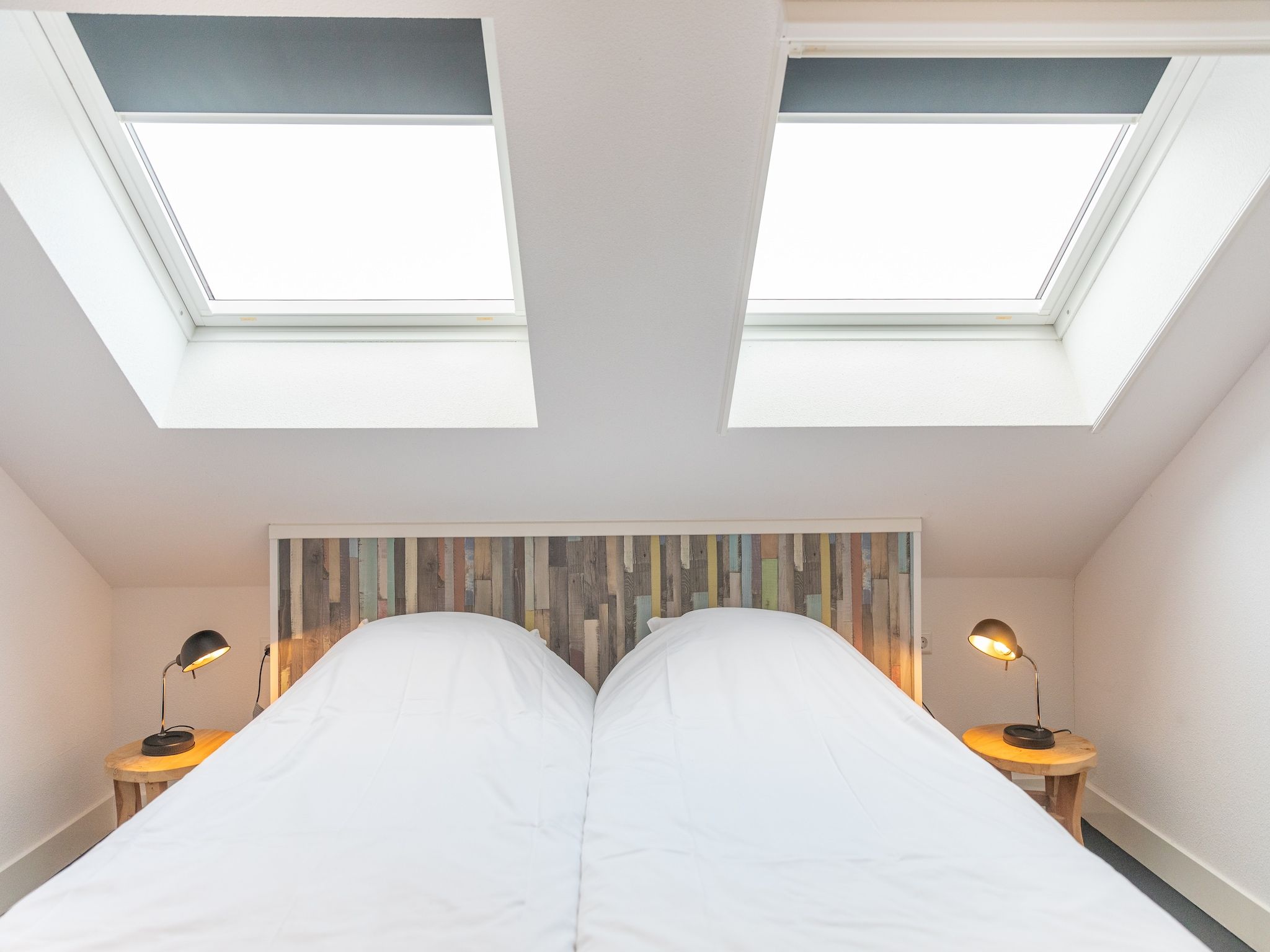 Een slaapkamer van Waddenweelde Texel in Den Burg