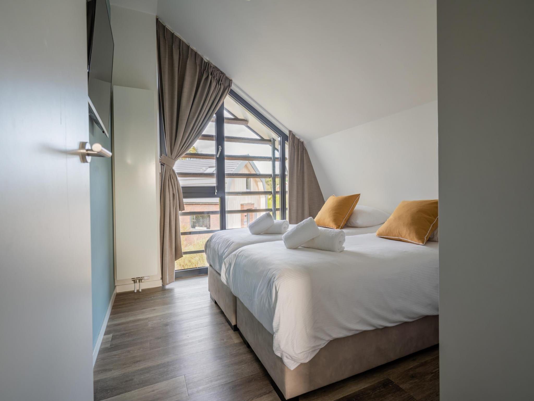 Een slaapkamer van Zicht op de Molen in Egmond aan den Hoef