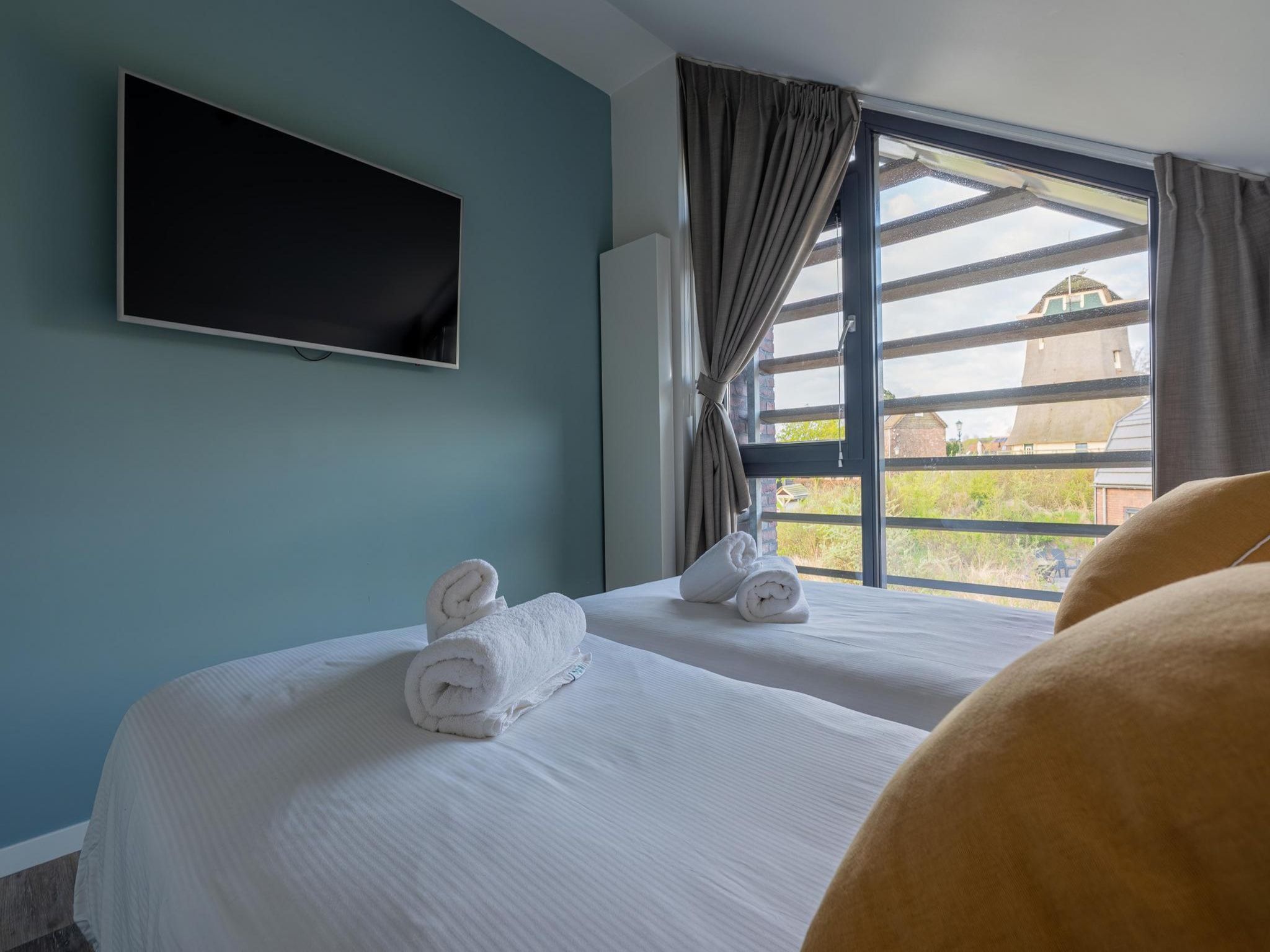 Een slaapkamer van Zicht op de Molen in Egmond aan den Hoef