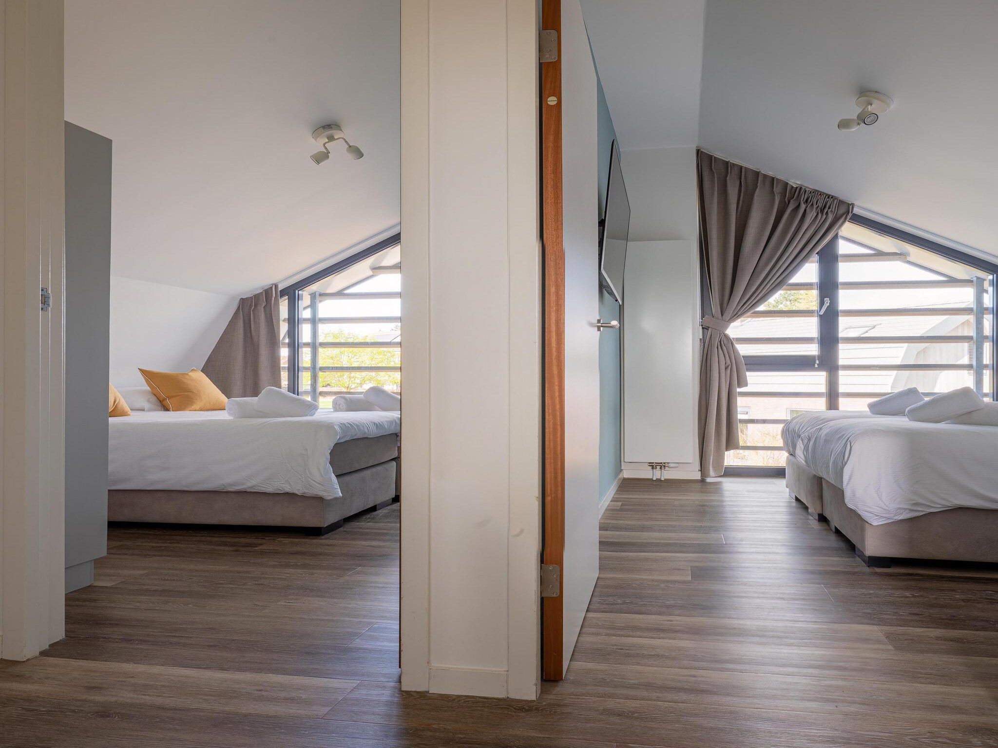 Een slaapkamer van Zicht op de Molen in Egmond aan den Hoef