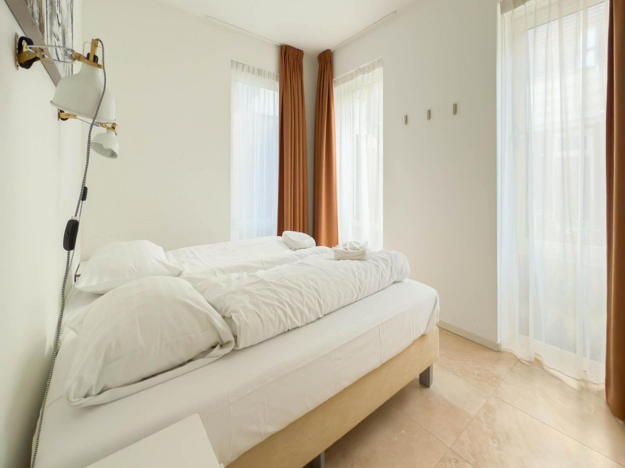 Een slaapkamer van Zilverlicht in Egmond aan Zee
