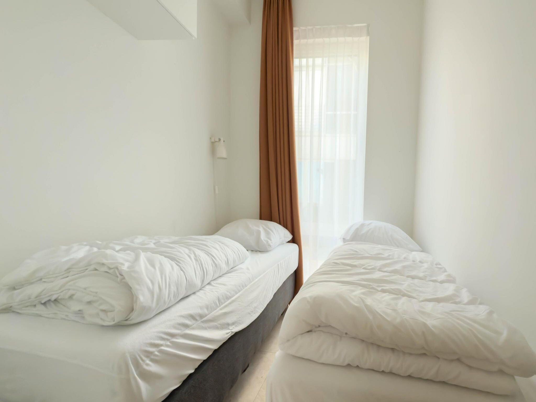 Een slaapkamer van Zilverlicht in Egmond aan Zee