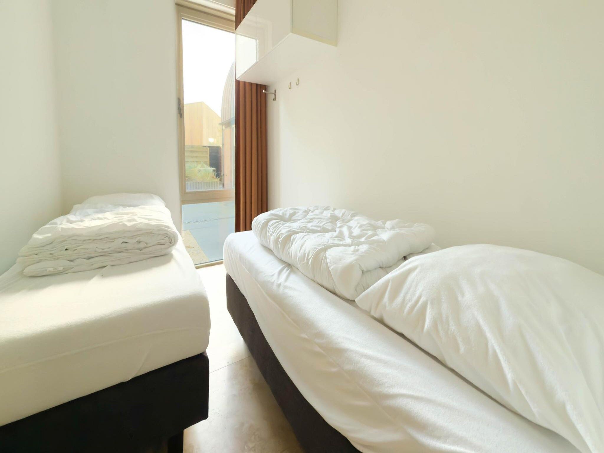 Een slaapkamer van Zilverlicht in Egmond aan Zee
