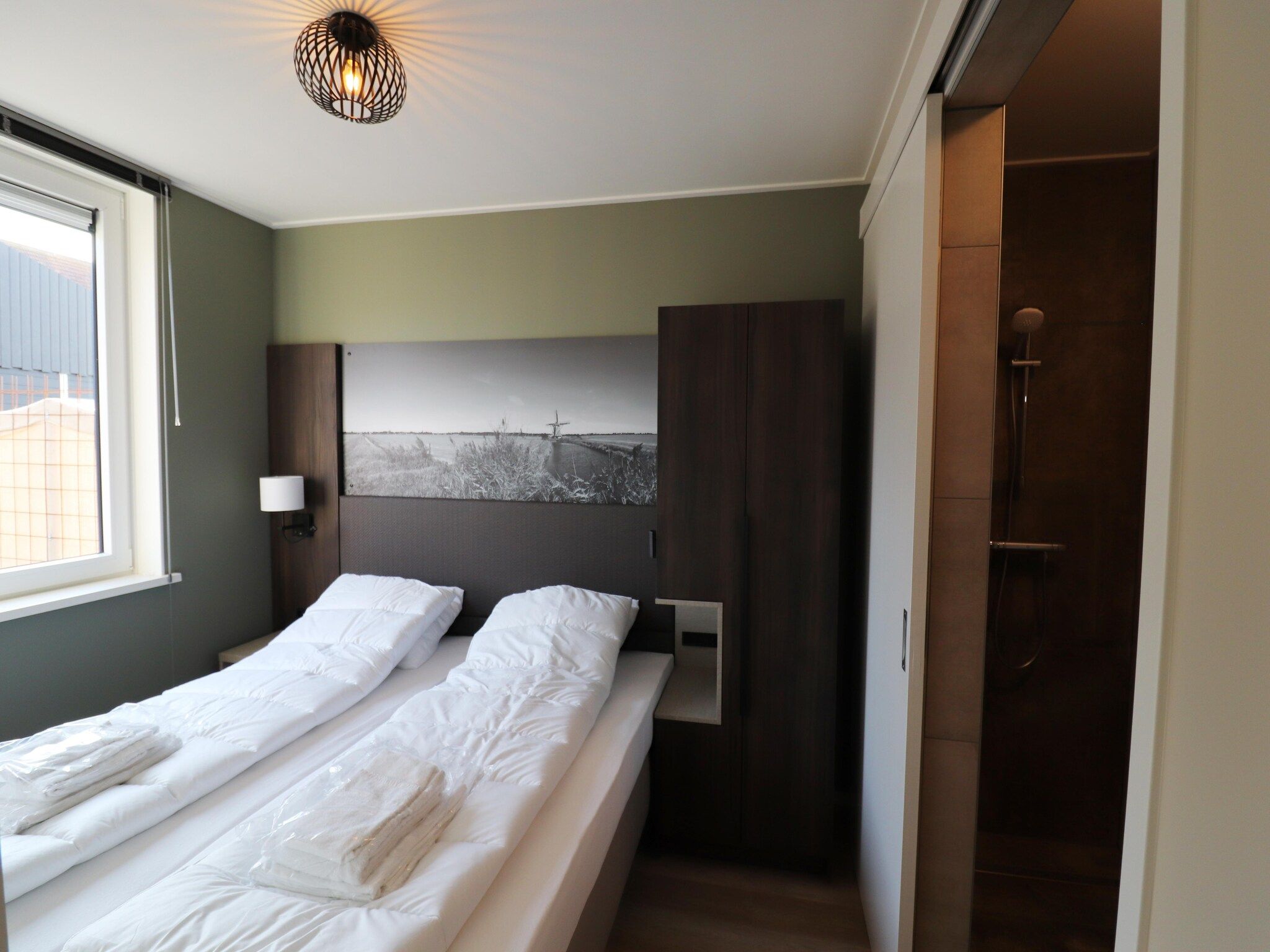 Een slaapkamer van Moderne villa op het Friese platteland in leons