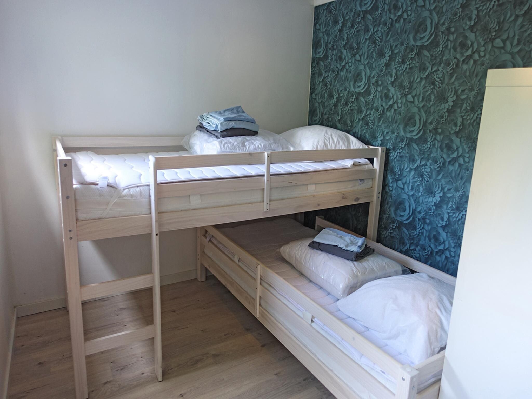 Een slaapkamer van Vechtdalchalet de Wilg in Rheezerveen