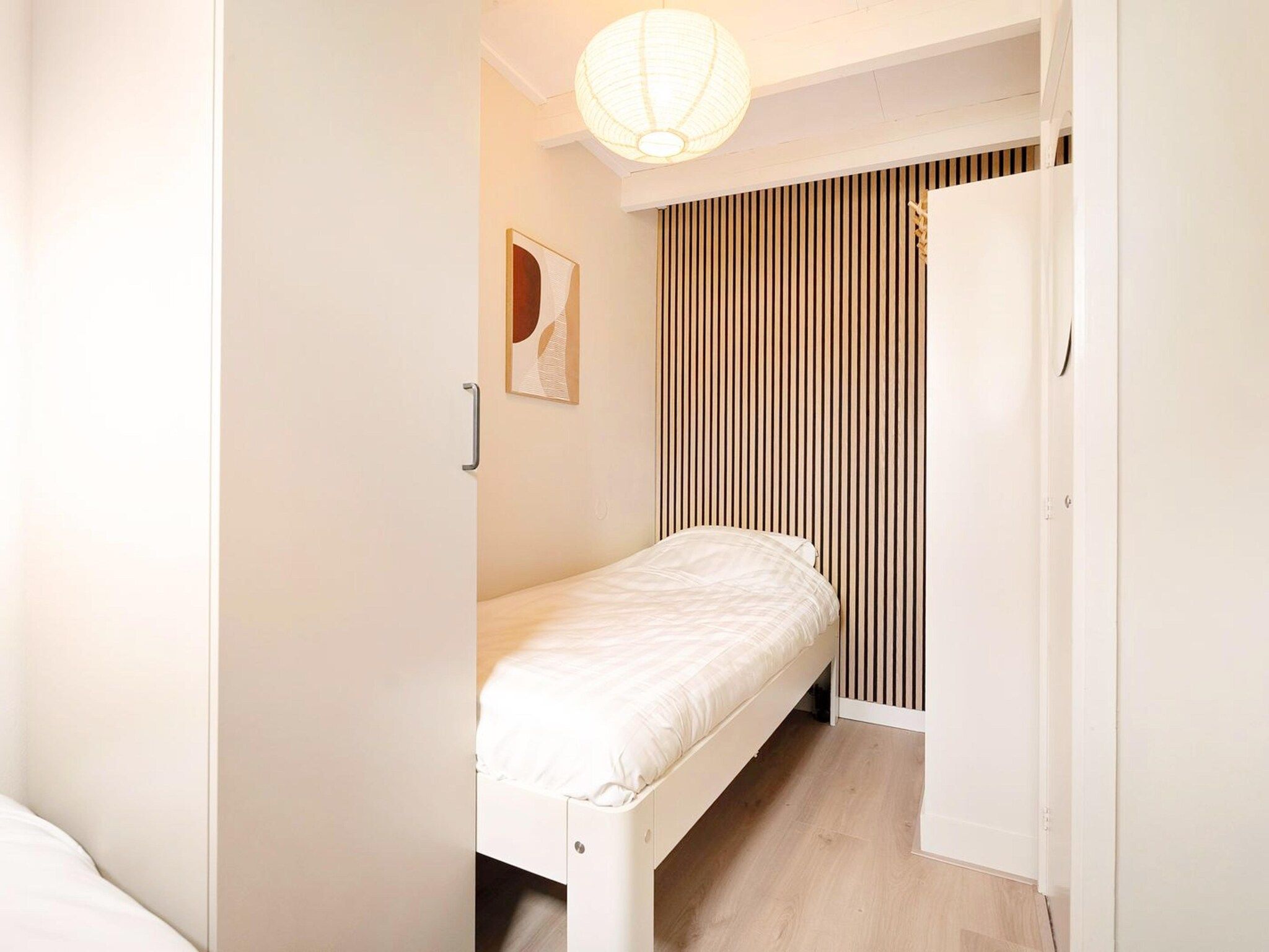 Een slaapkamer van Duinland 118 in Sint Maartensvlotbrug