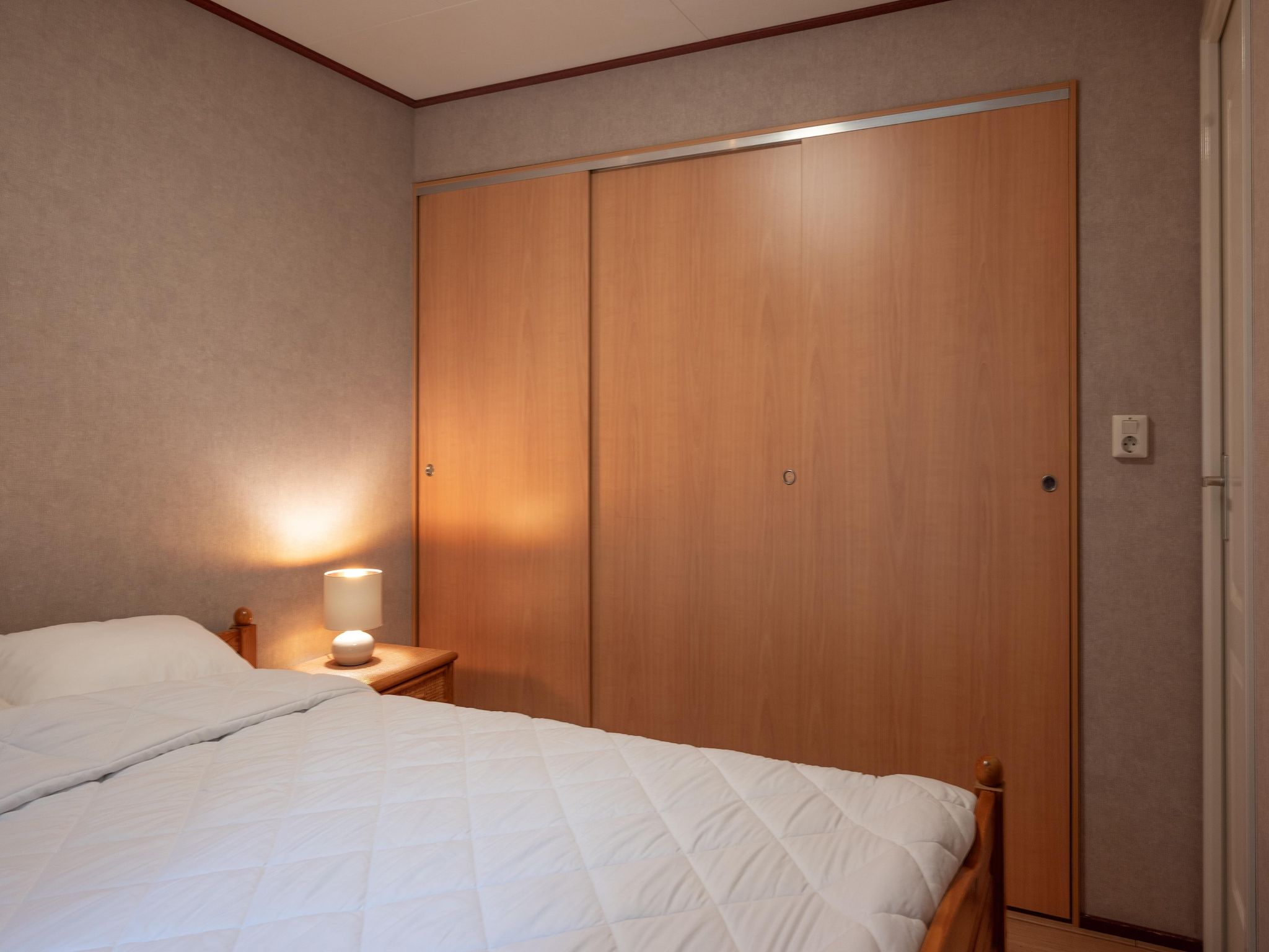 Een slaapkamer van Vakantie home Coevorderweg in Stegeren