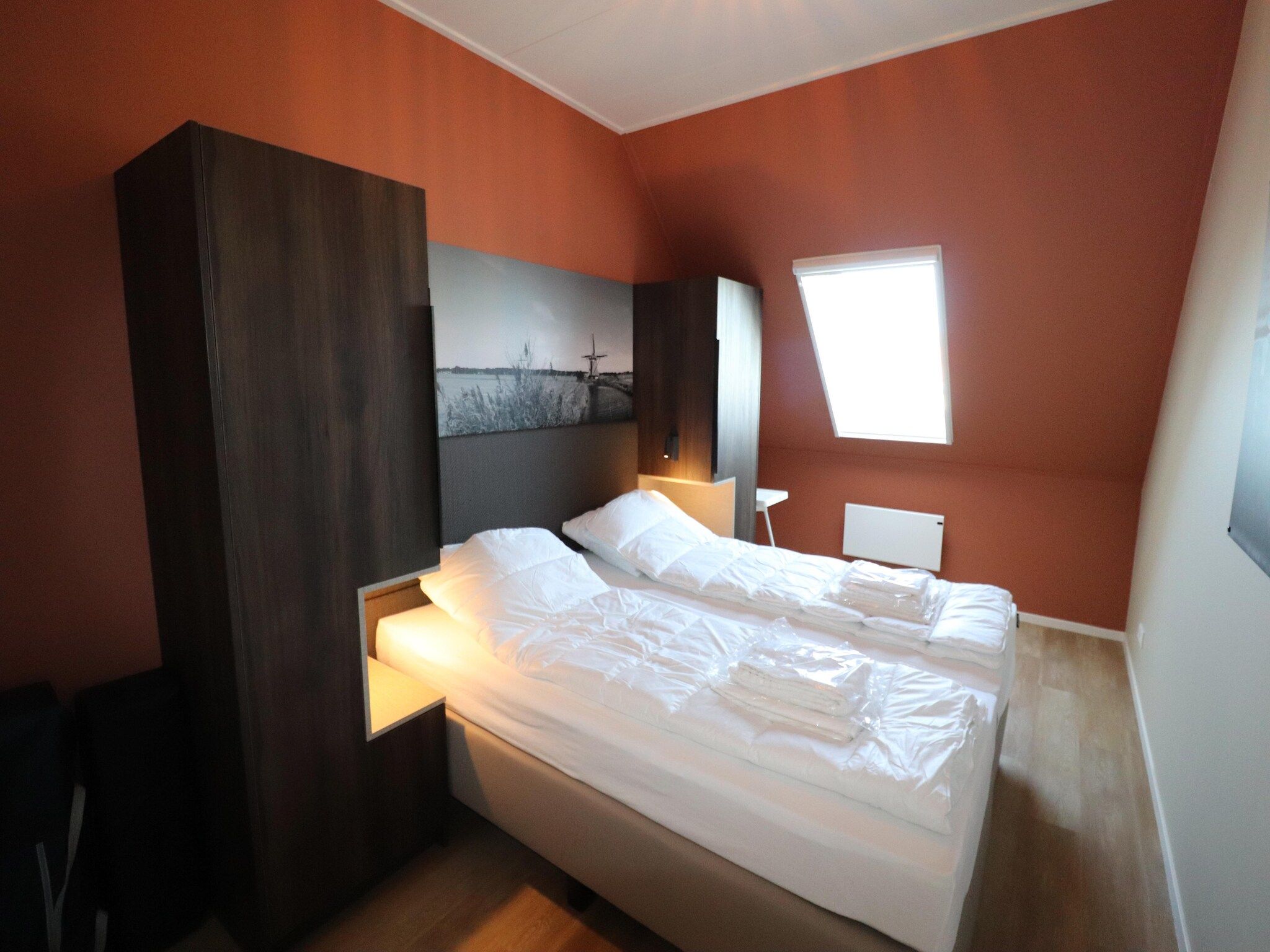 Een slaapkamer van Moderne hoekvilla middenin Friesland in leons