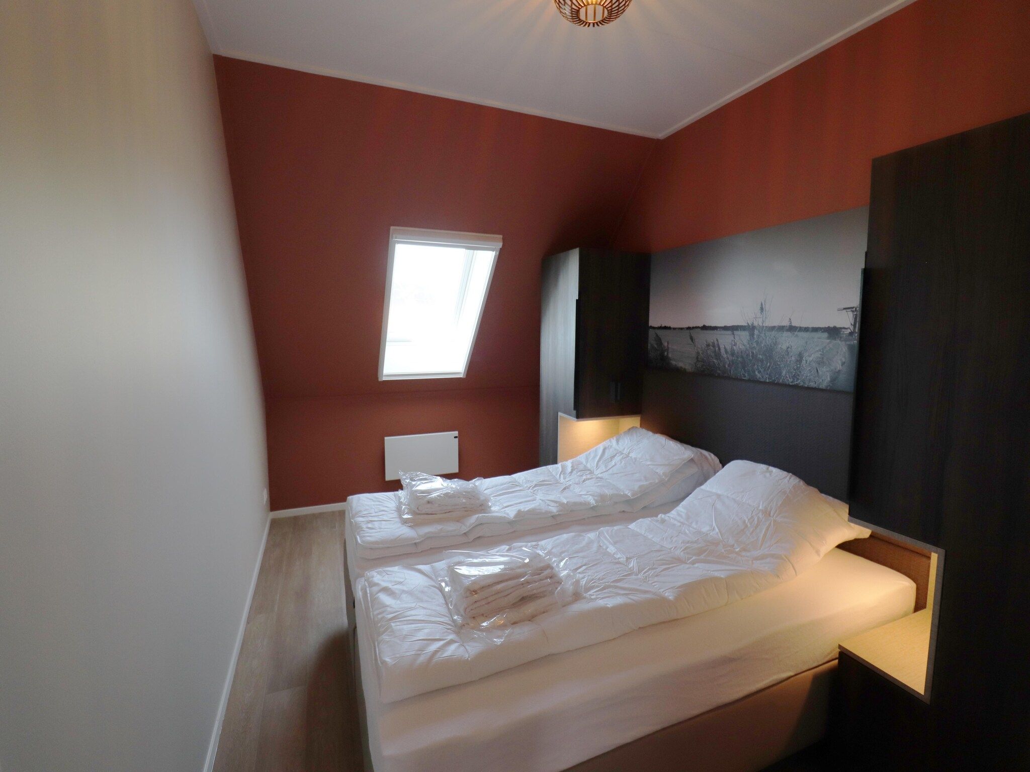 Een slaapkamer van 16 persoons villa C en D in Leons
